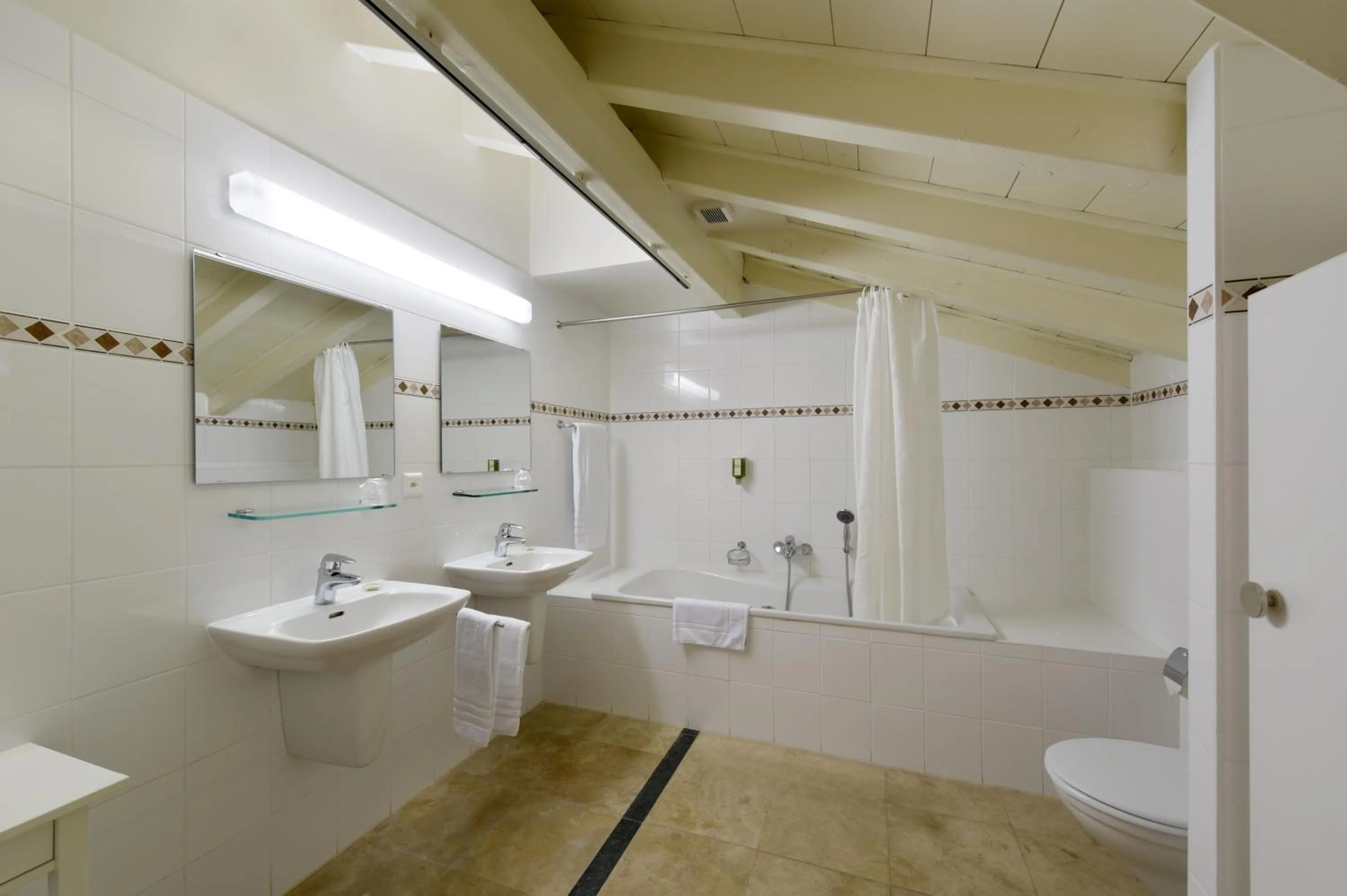 Bathroom in L'Hôtel by Hostellerie du Château