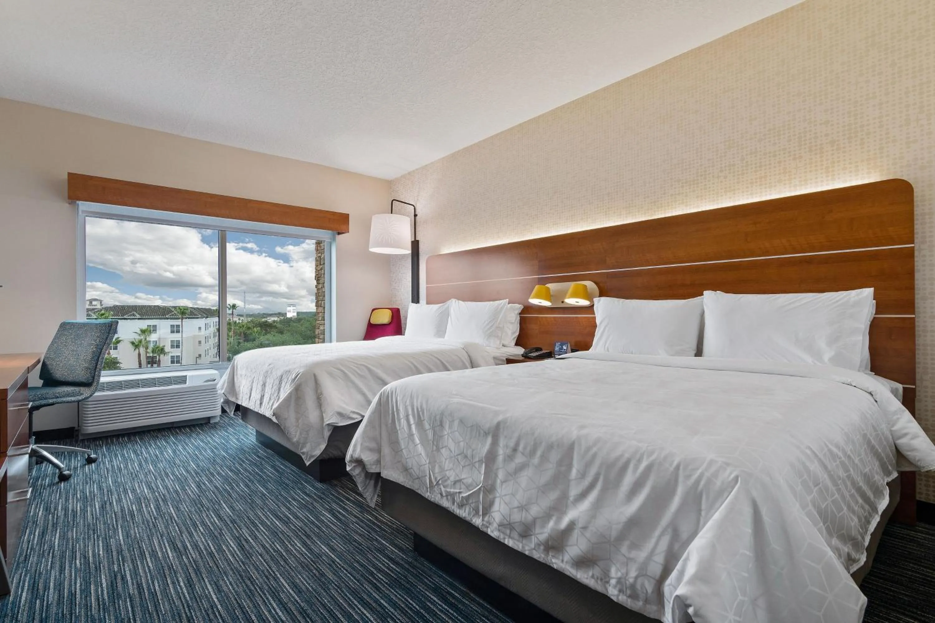 Photo of the whole room, Bed in Holiday Inn Express & Suites Orlando- Lake Buena Vista by IHG