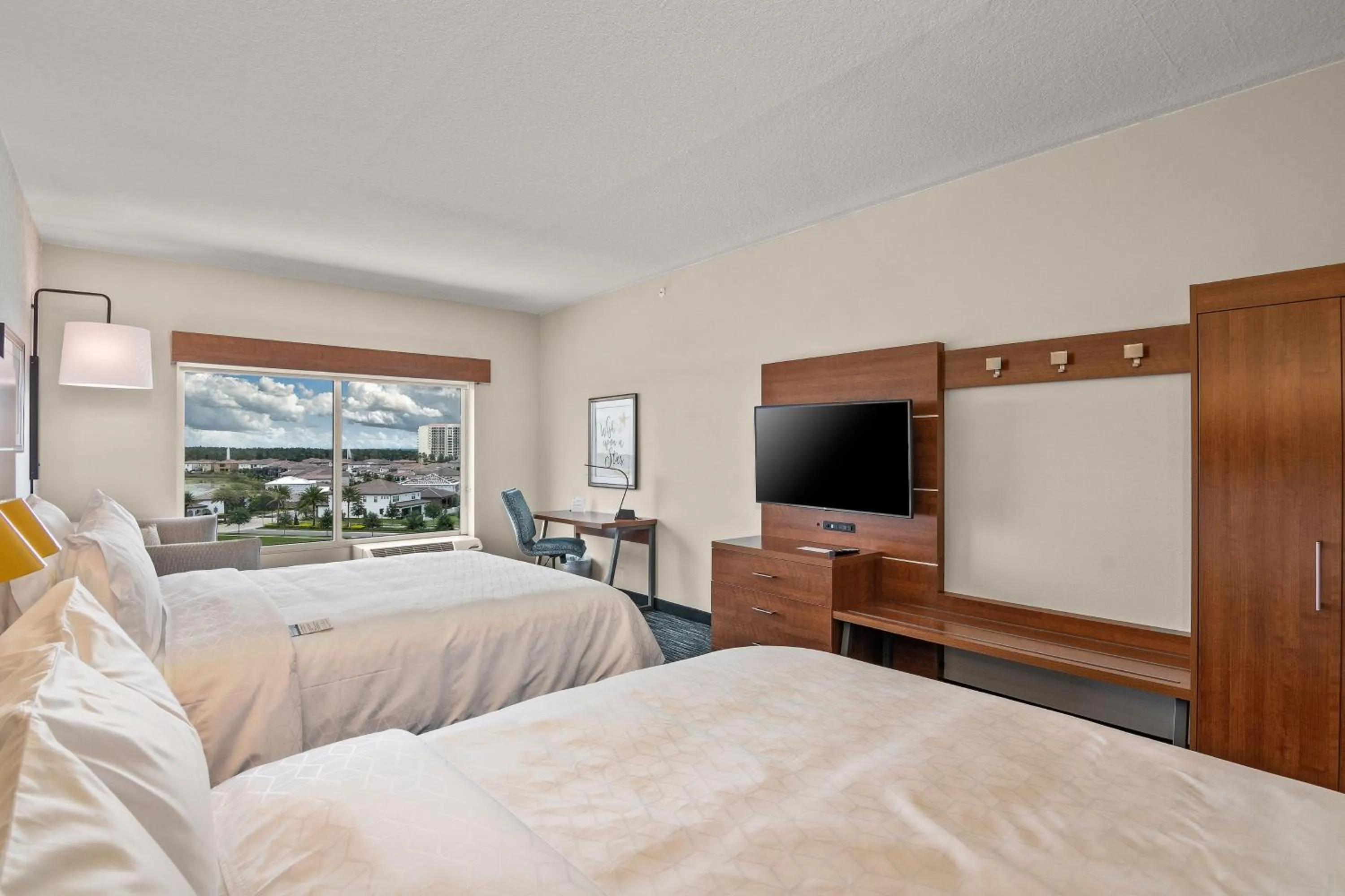 Photo of the whole room, Bed in Holiday Inn Express & Suites Orlando- Lake Buena Vista by IHG