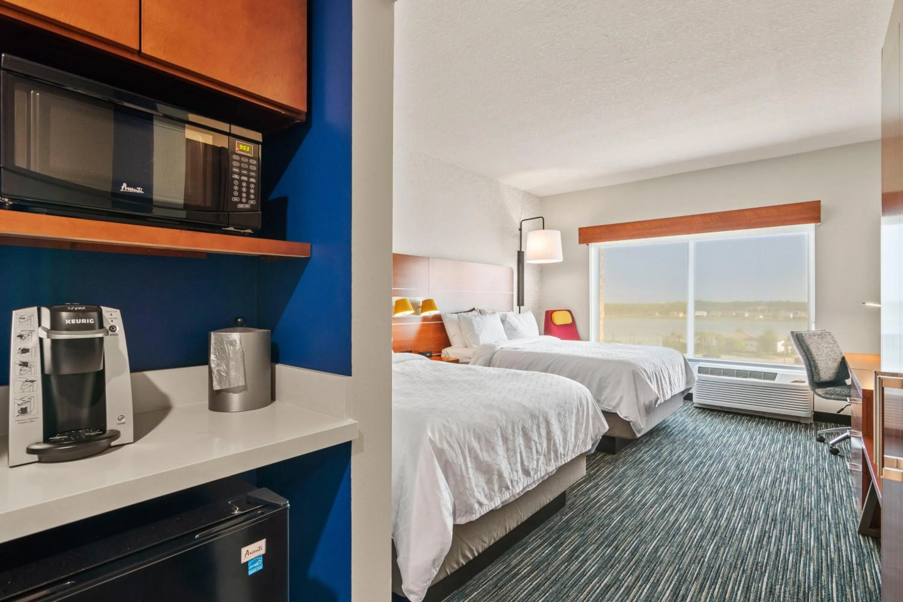 Photo of the whole room, Bed in Holiday Inn Express & Suites Orlando- Lake Buena Vista by IHG