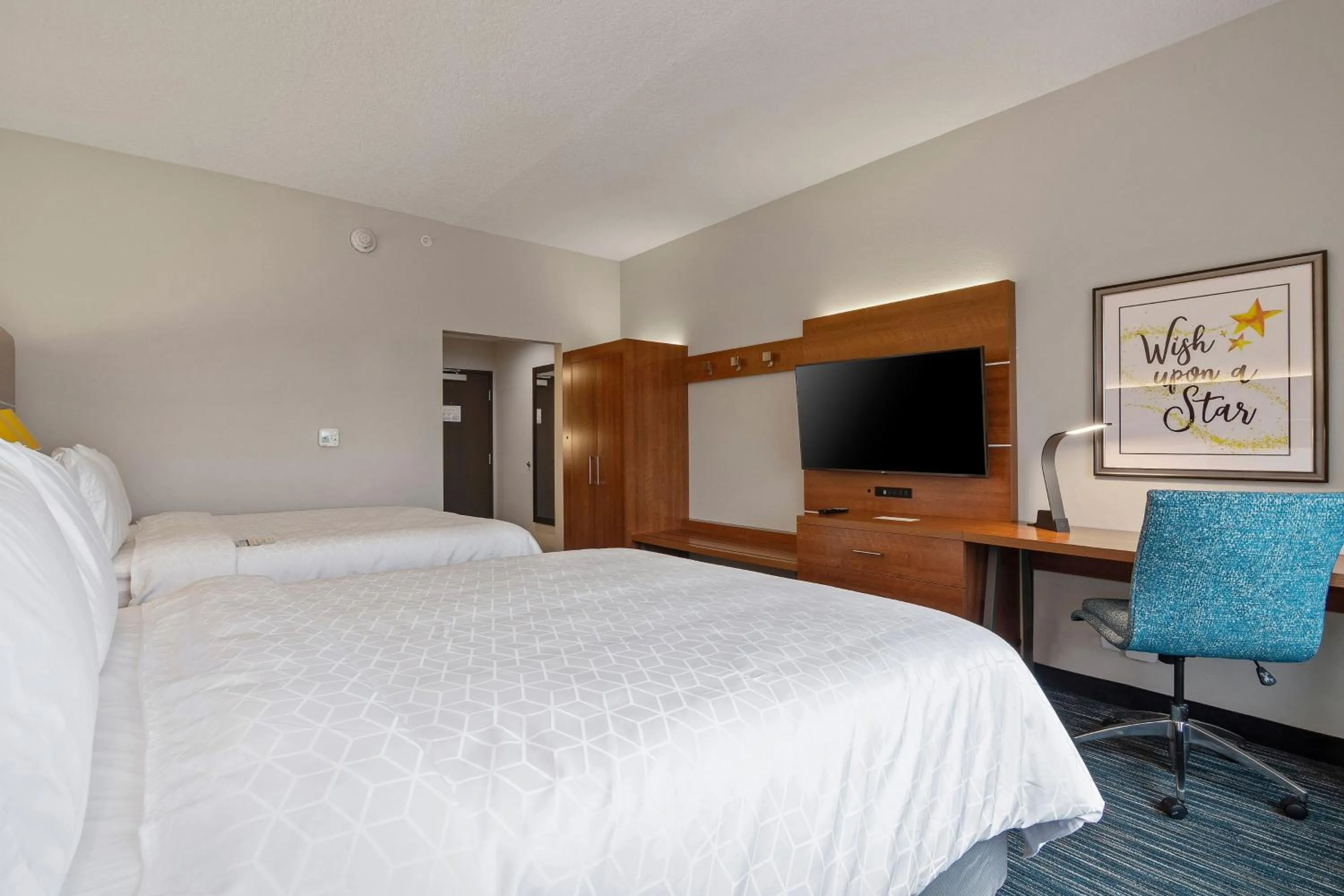 Photo of the whole room, Bed in Holiday Inn Express & Suites Orlando- Lake Buena Vista by IHG