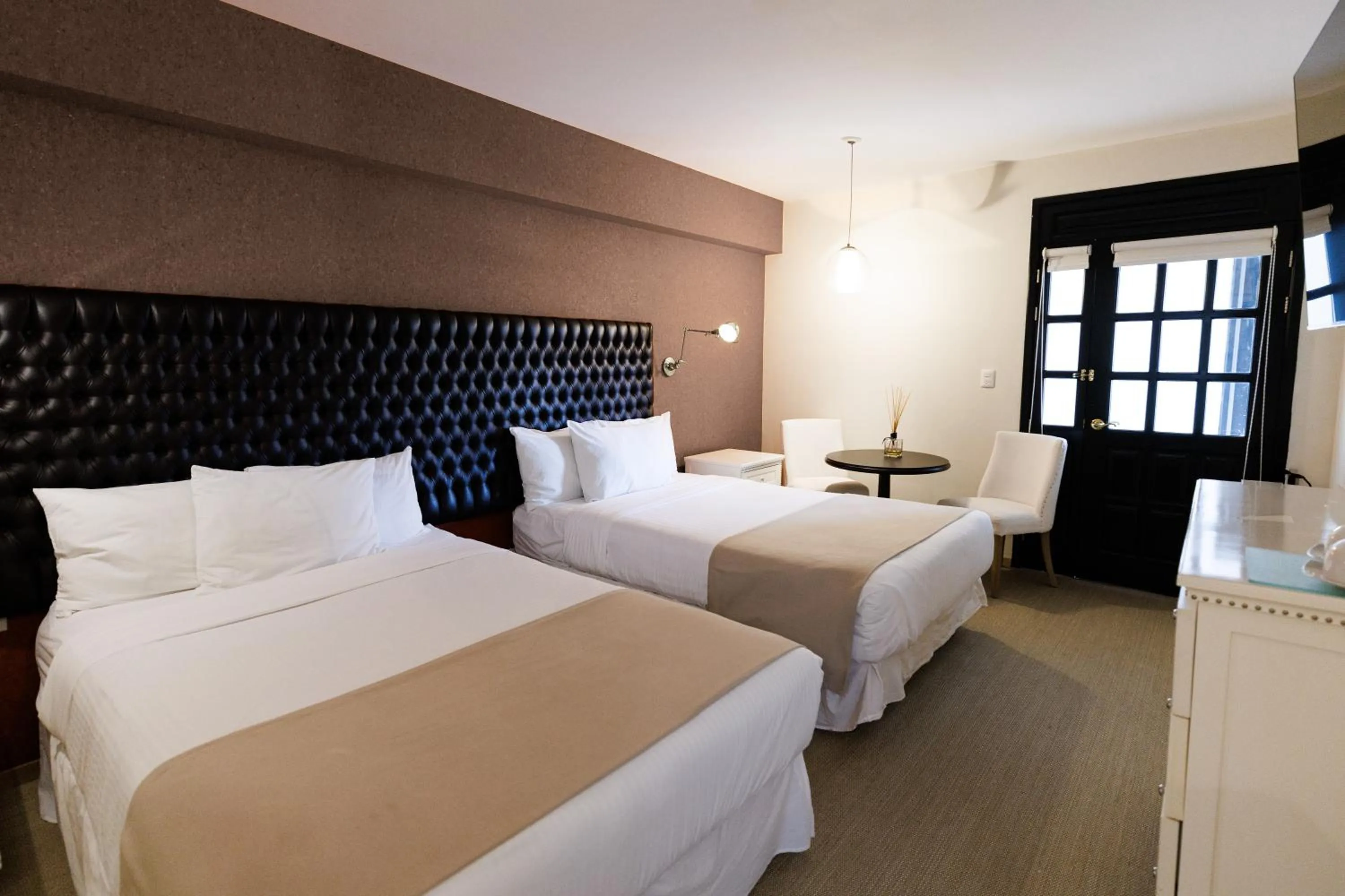 Bed in Casa Bonita Hotel & Luxury Residence