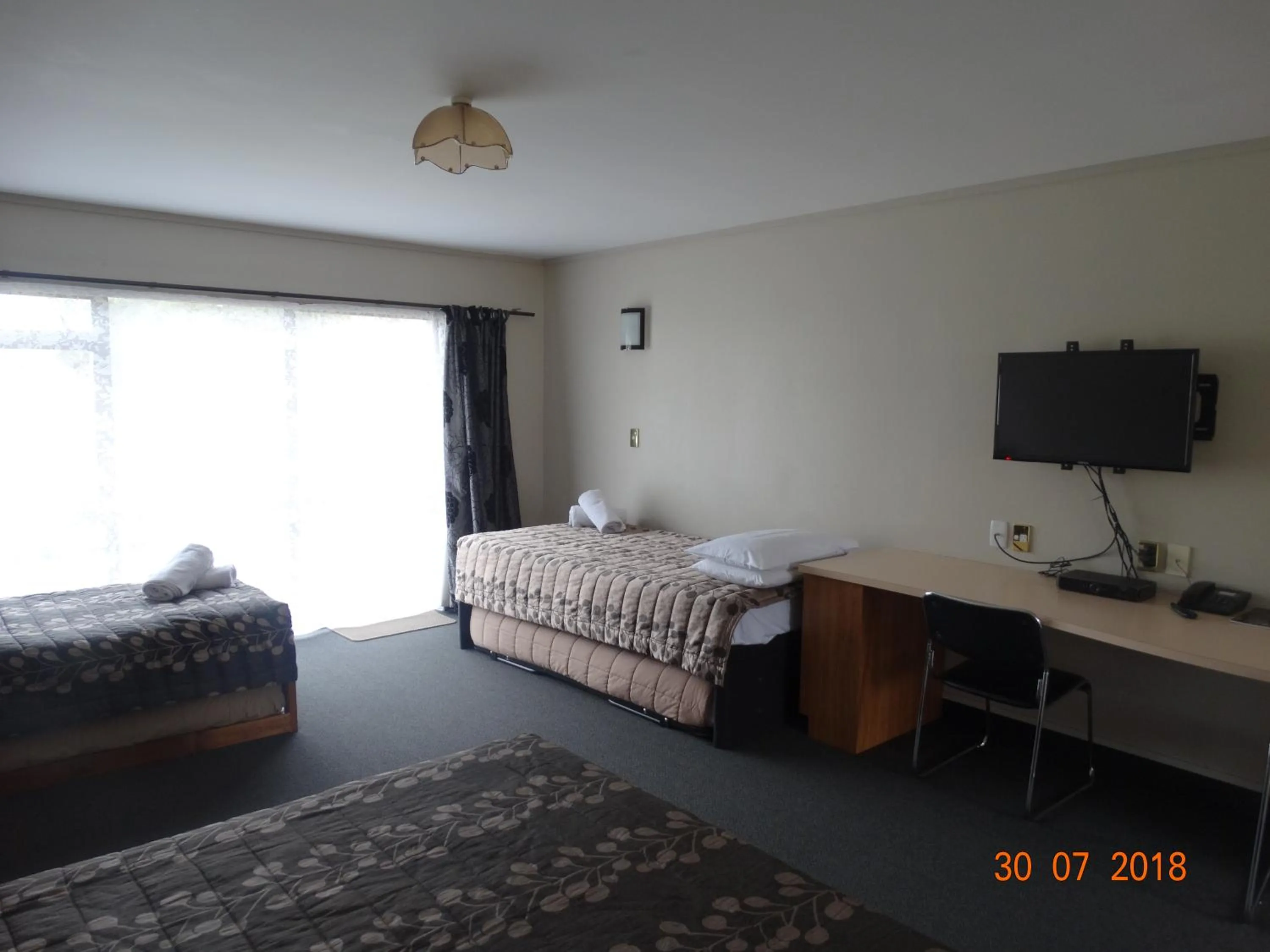 Bed in Ambassador Motel