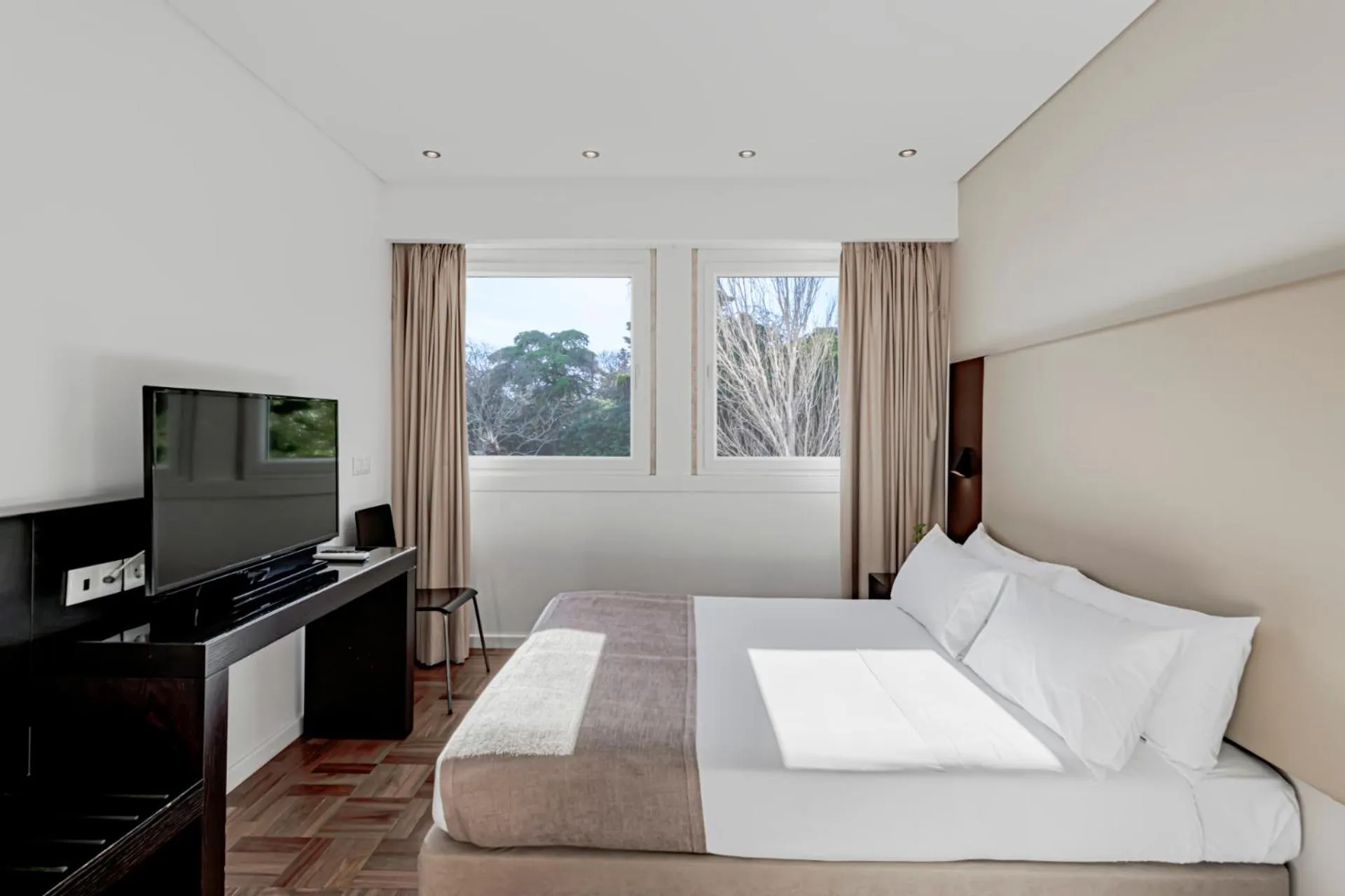 Bed in Lisboa Central Park Hotel Suites & Studios