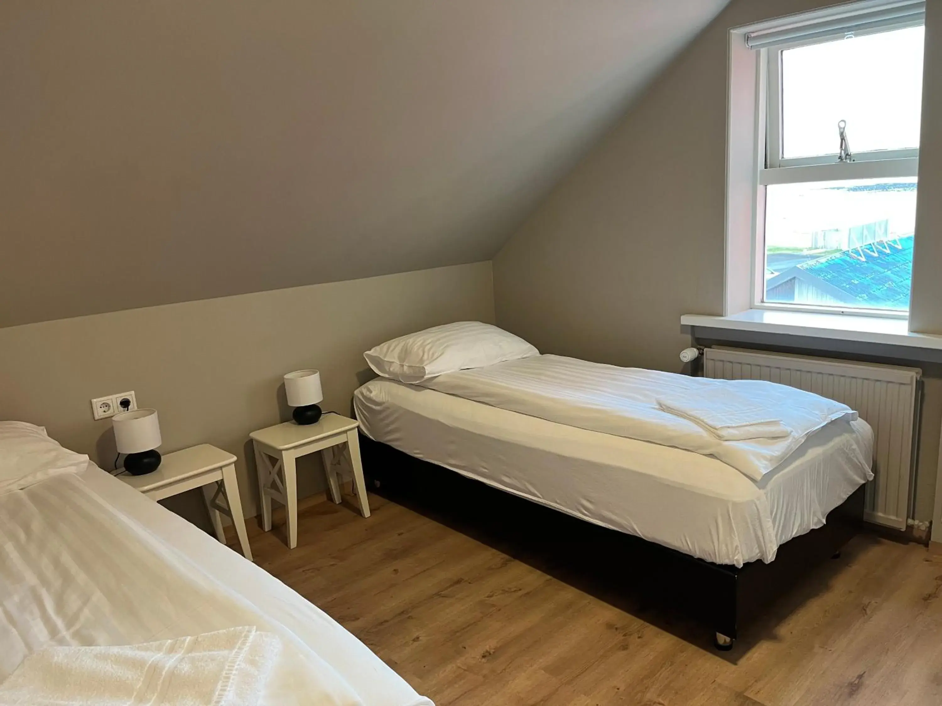 Bedroom, Bed in Hvammur Apartments by the Harbour Bedroom, Bed in Hvammur Apartments by the Harbour