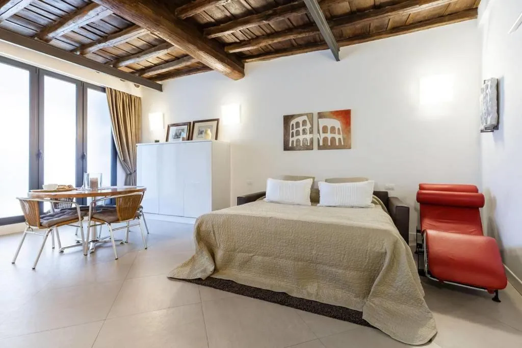 Living room, Bed in Maison Romana Loft