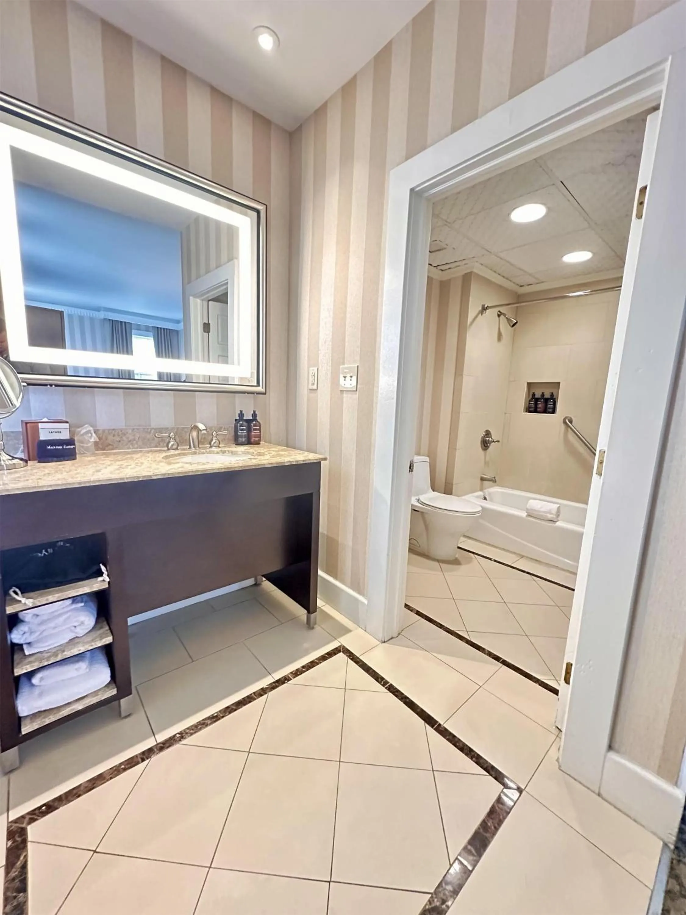 Bathroom, Bed in The Equinox Golf Resort & Spa