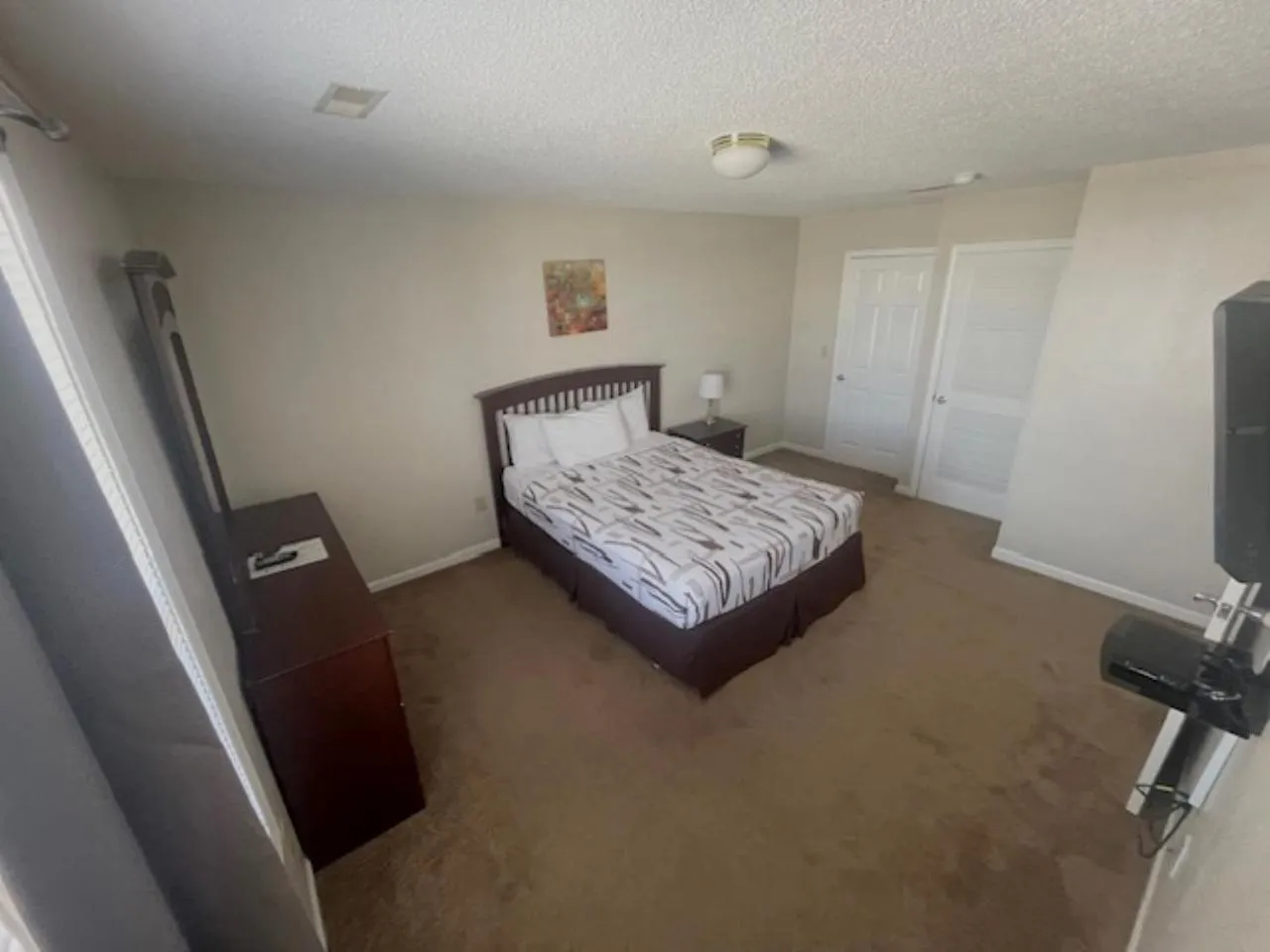 Bed in Bell's Extended Stay and Suites