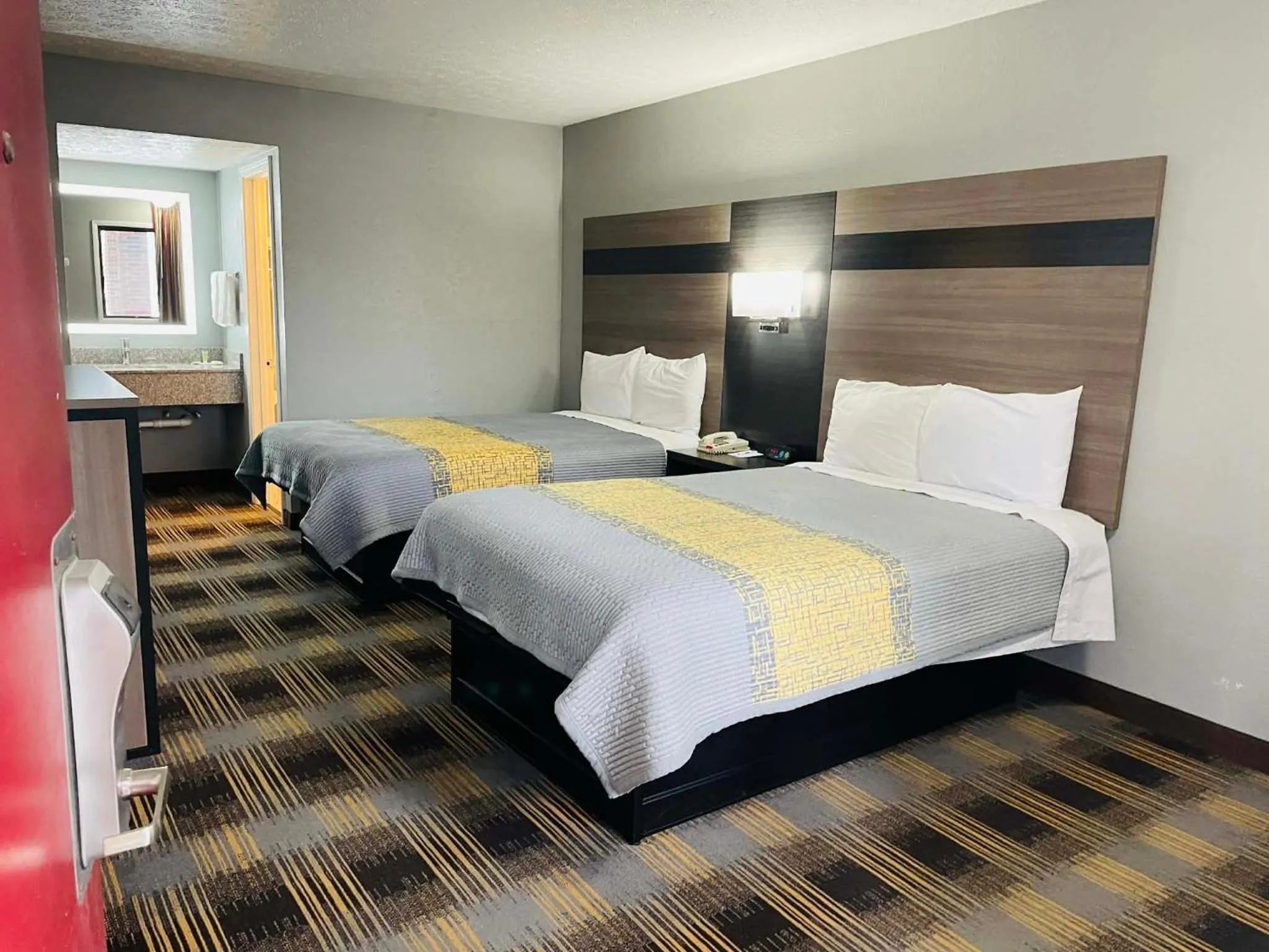 Bed in Travelodge by Wyndham Sellersburg