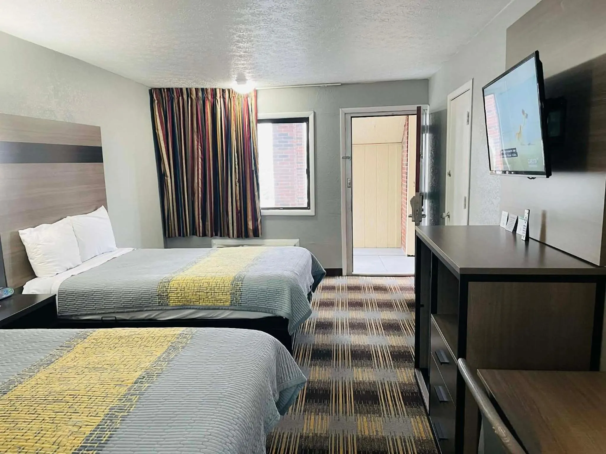 Bed in Travelodge by Wyndham Sellersburg