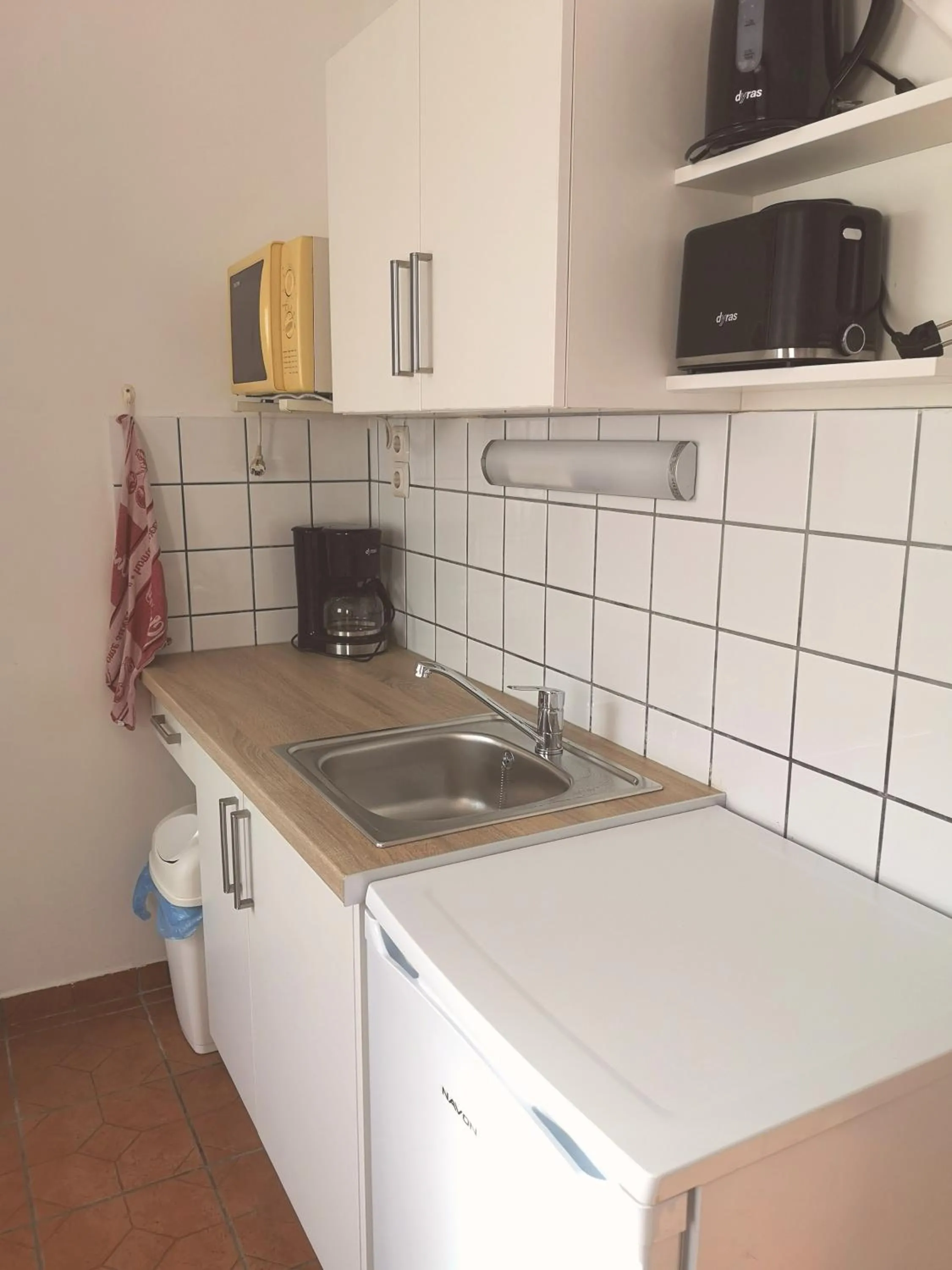 Kitchen or kitchenette in Apartman Kaszás Garden