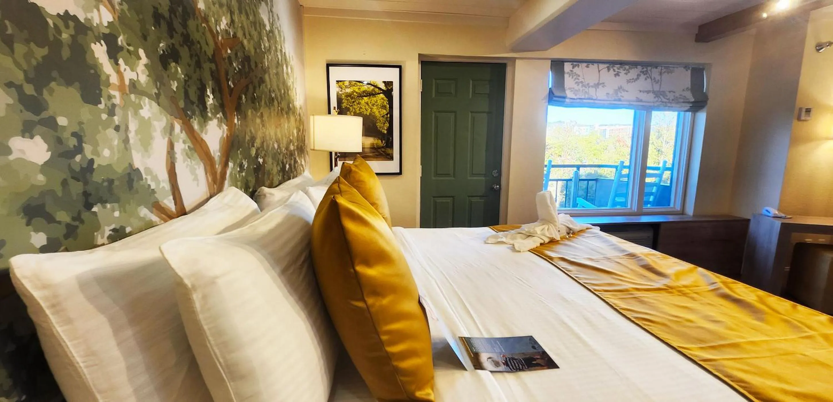 Bed in Arbors at Island Landing Hotel & Suites