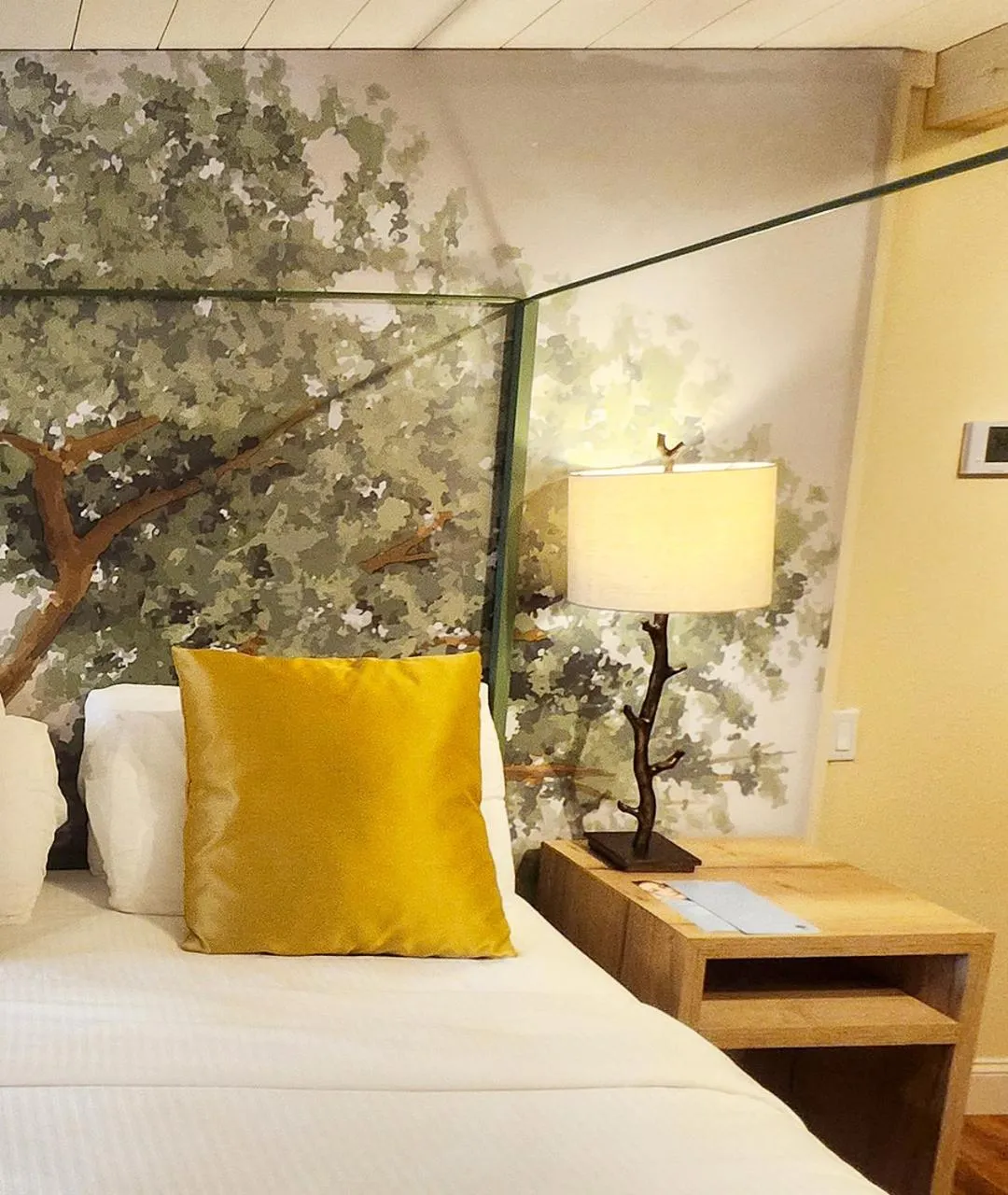 Bed in Arbors at Island Landing Hotel & Suites