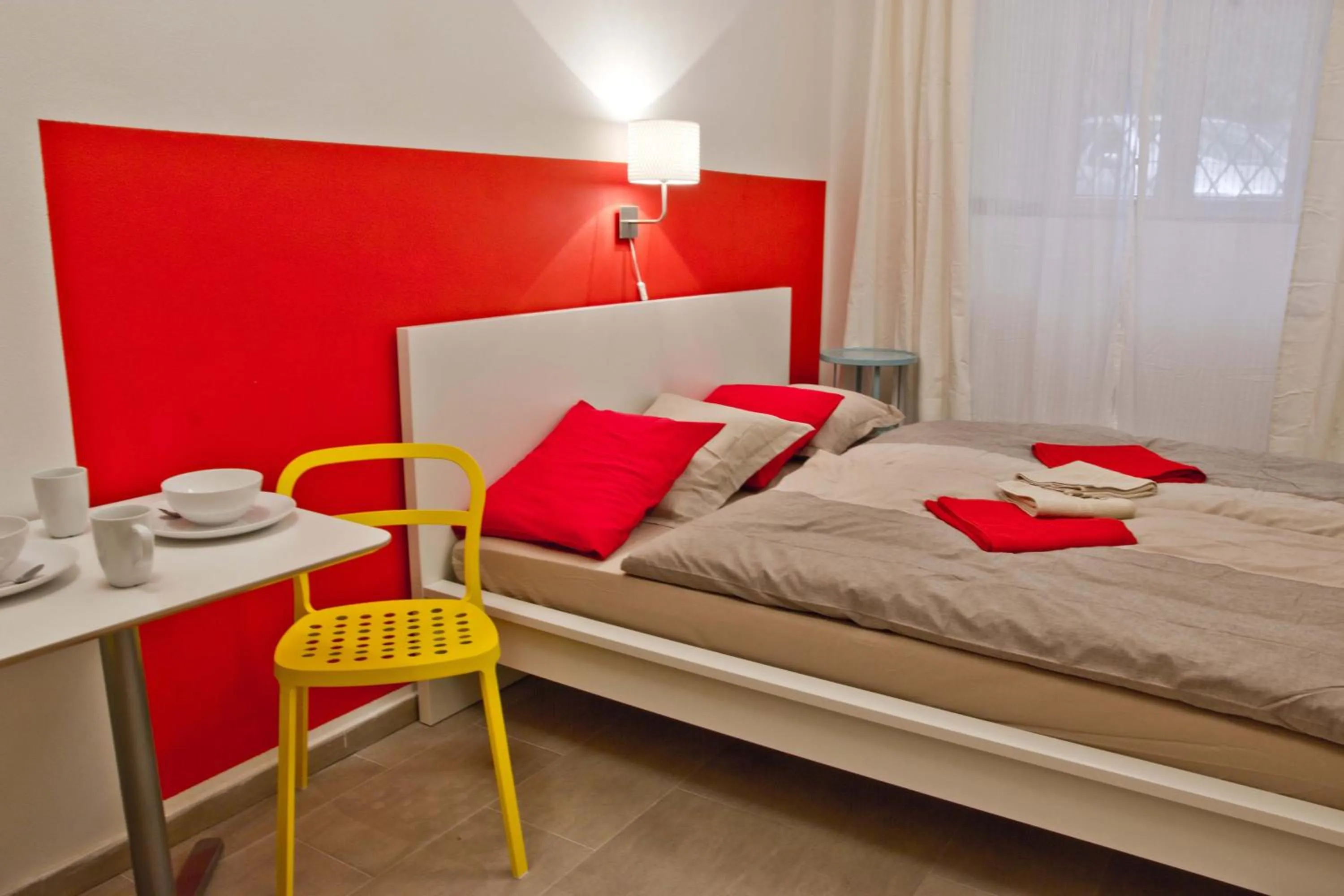 Photo of the whole room, Bed in Budget Apartment