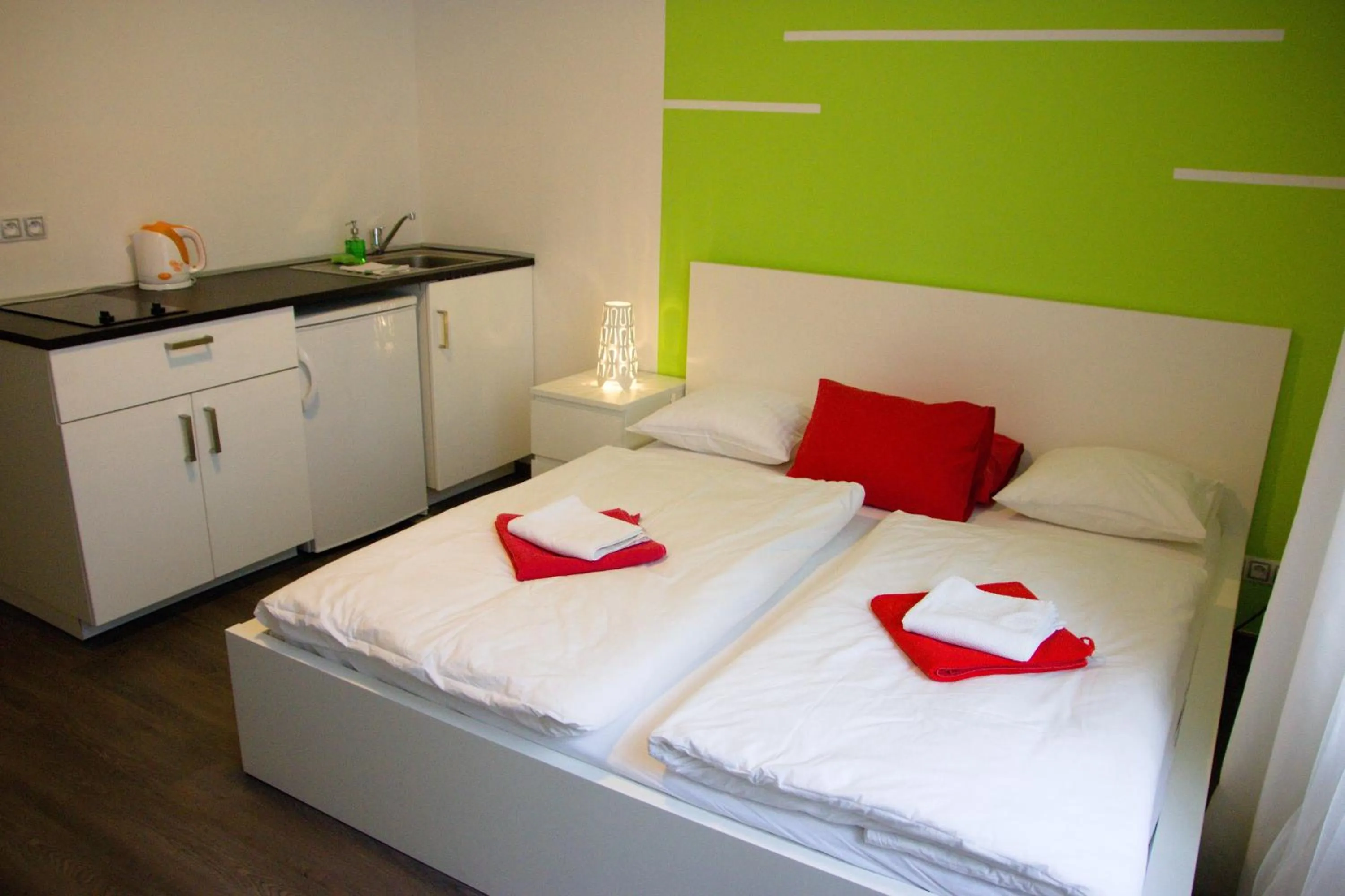 Photo of the whole room, Bed in Budget Apartment