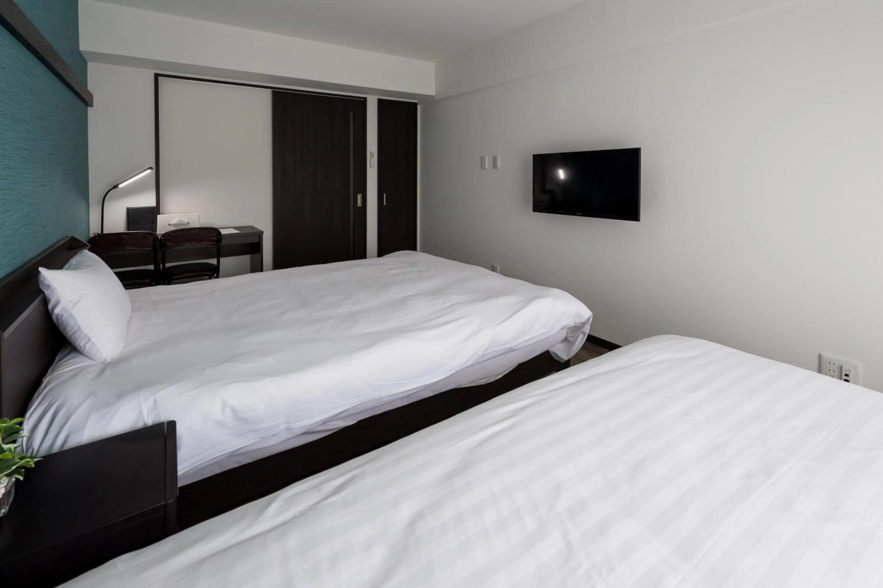 Bed in Hotel Tomas Nago