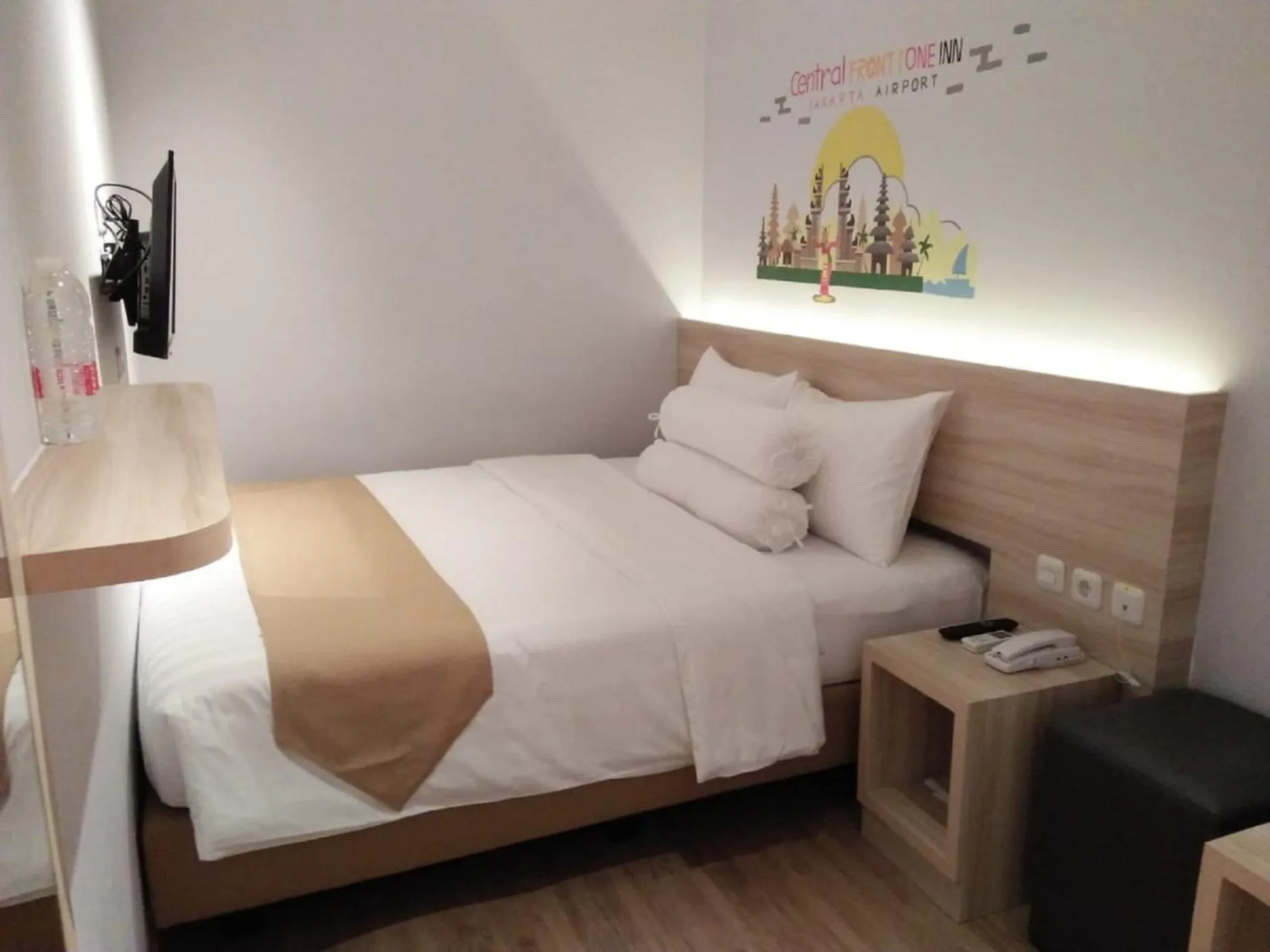 Bed in Central Front One Inn Jakarta Airport