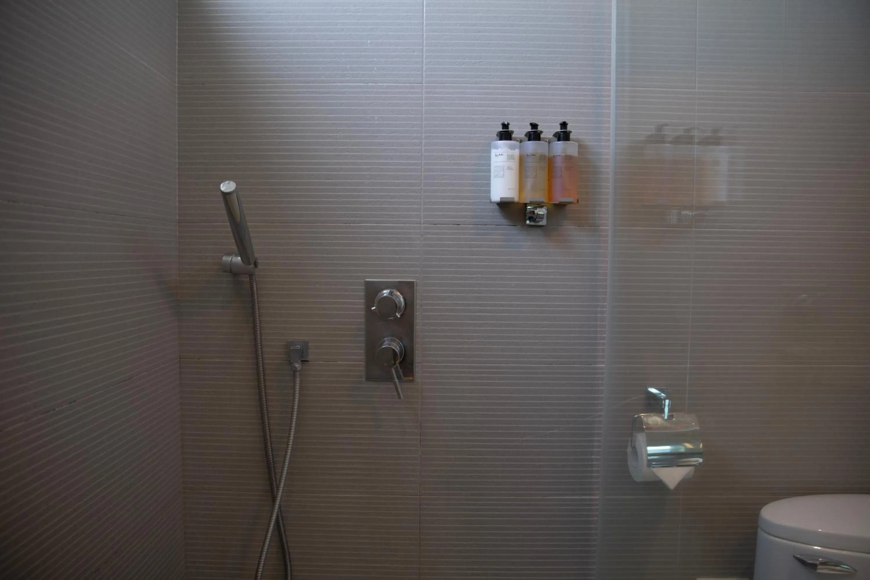 Shower in Kapok Hotel & Resorts
