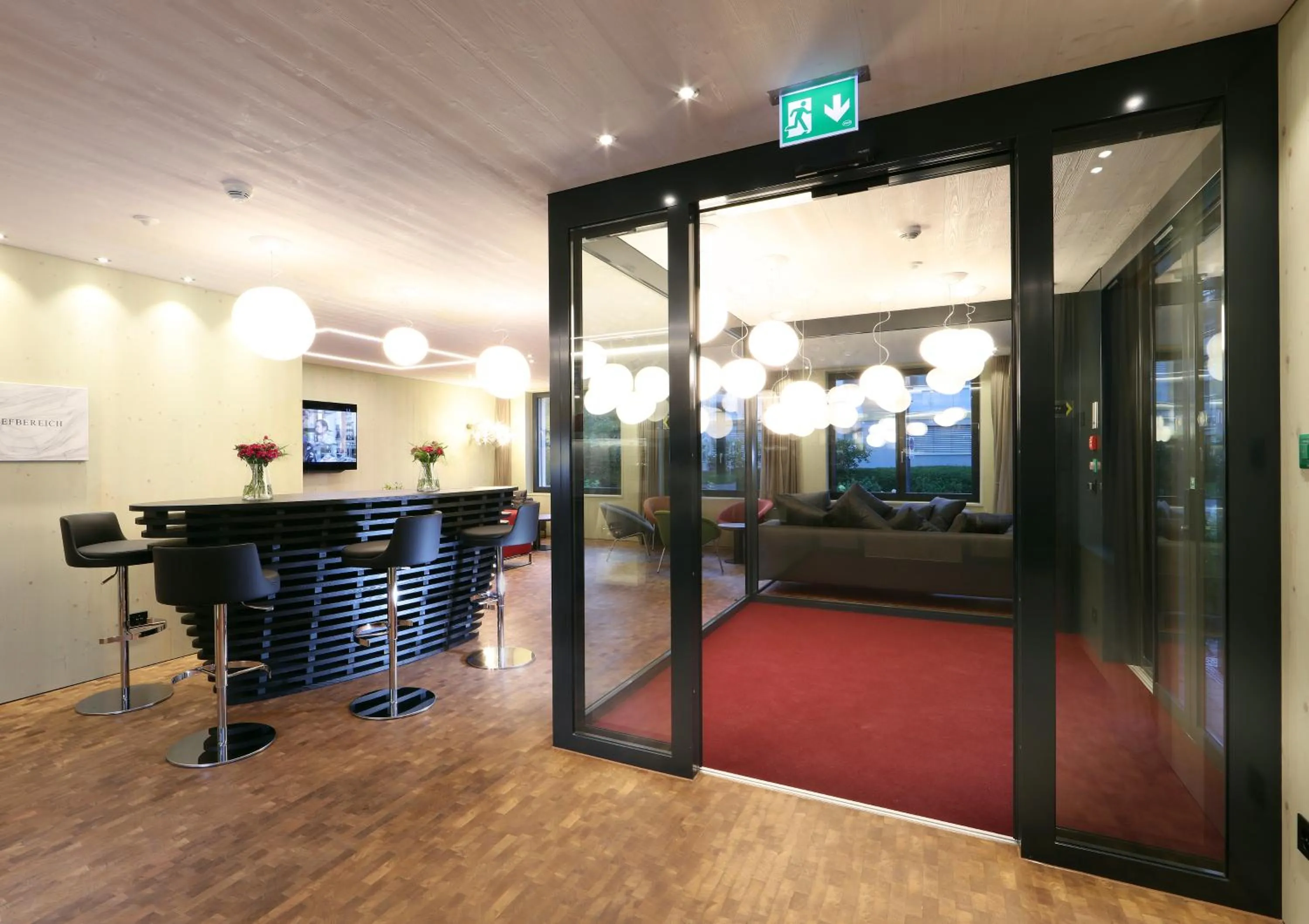 Communal lounge/ TV room in Lodge Hof Weissbad