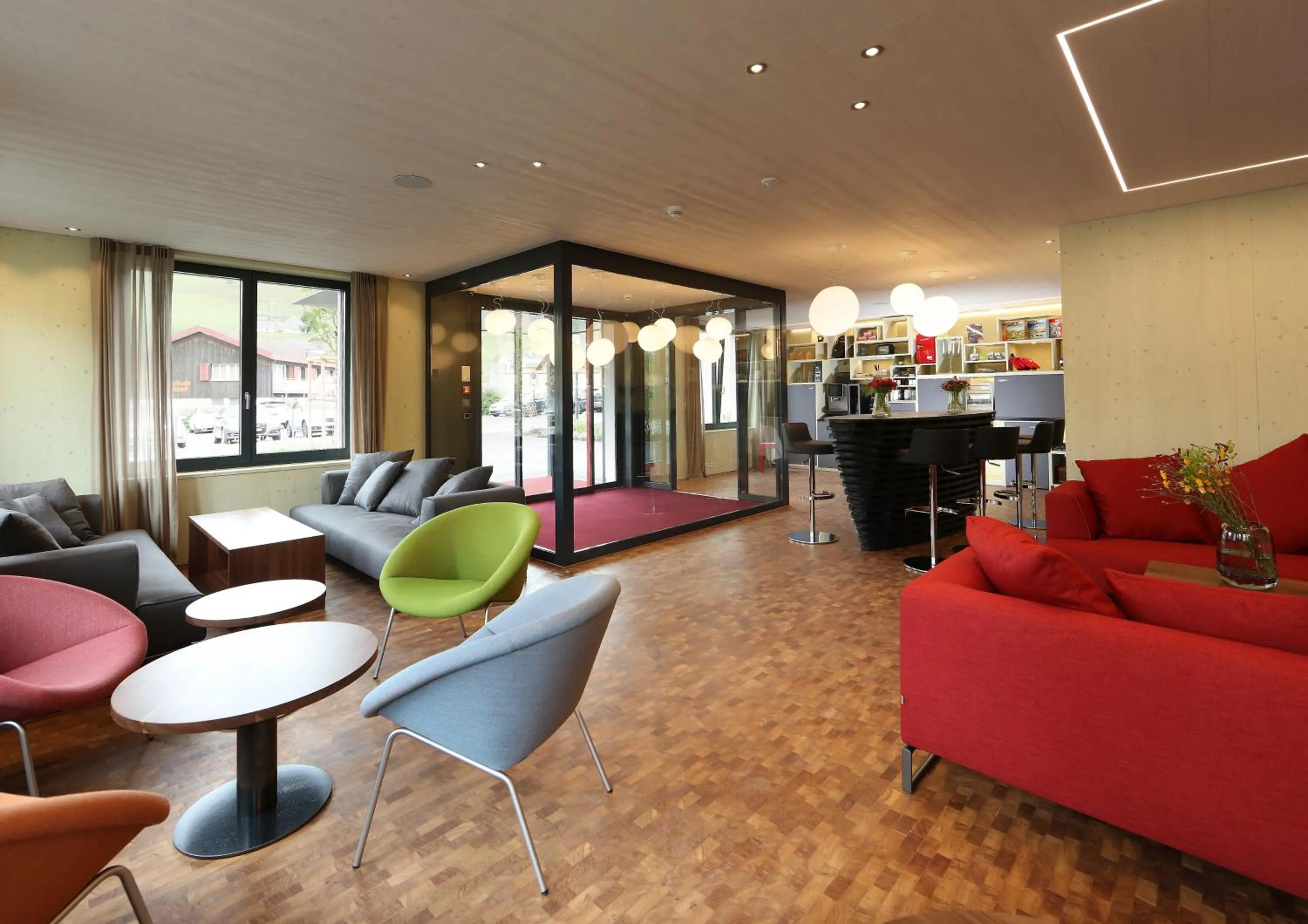 Communal lounge/ TV room in Lodge Hof Weissbad