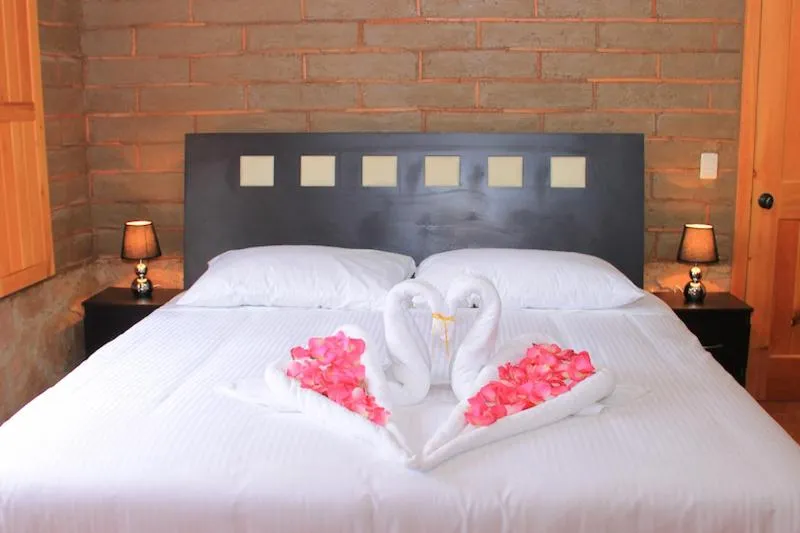 Bed in HOTEL Y CABAÑAS MOUNTAIN LODGE