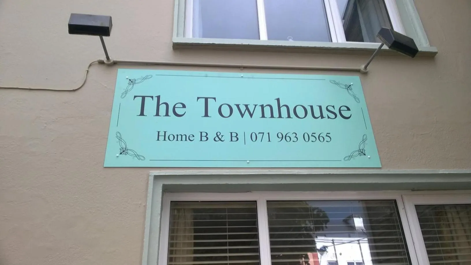Property logo or sign in The Townhouse