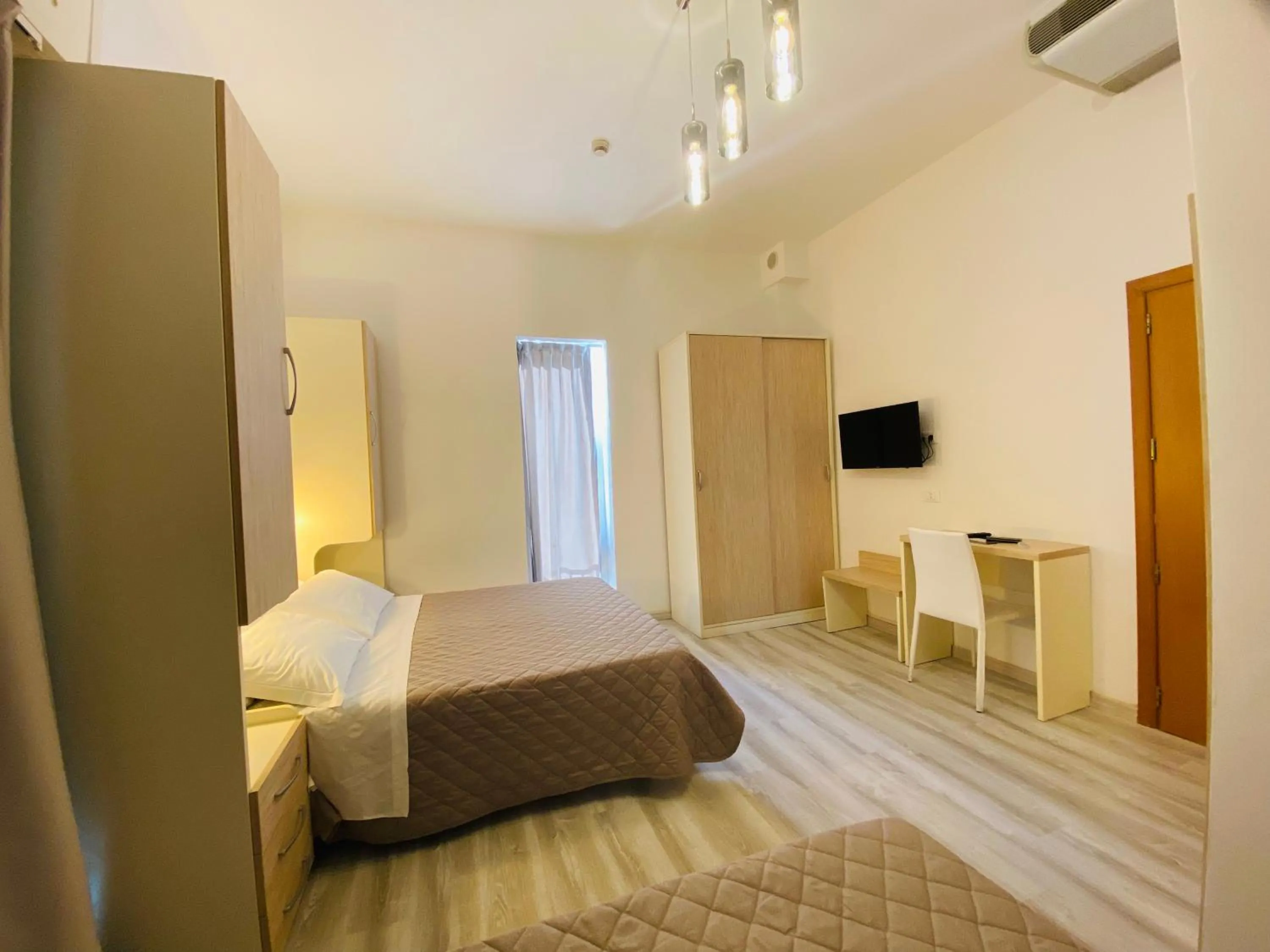 Bed in Hotel Butterfly Wellness & Spa