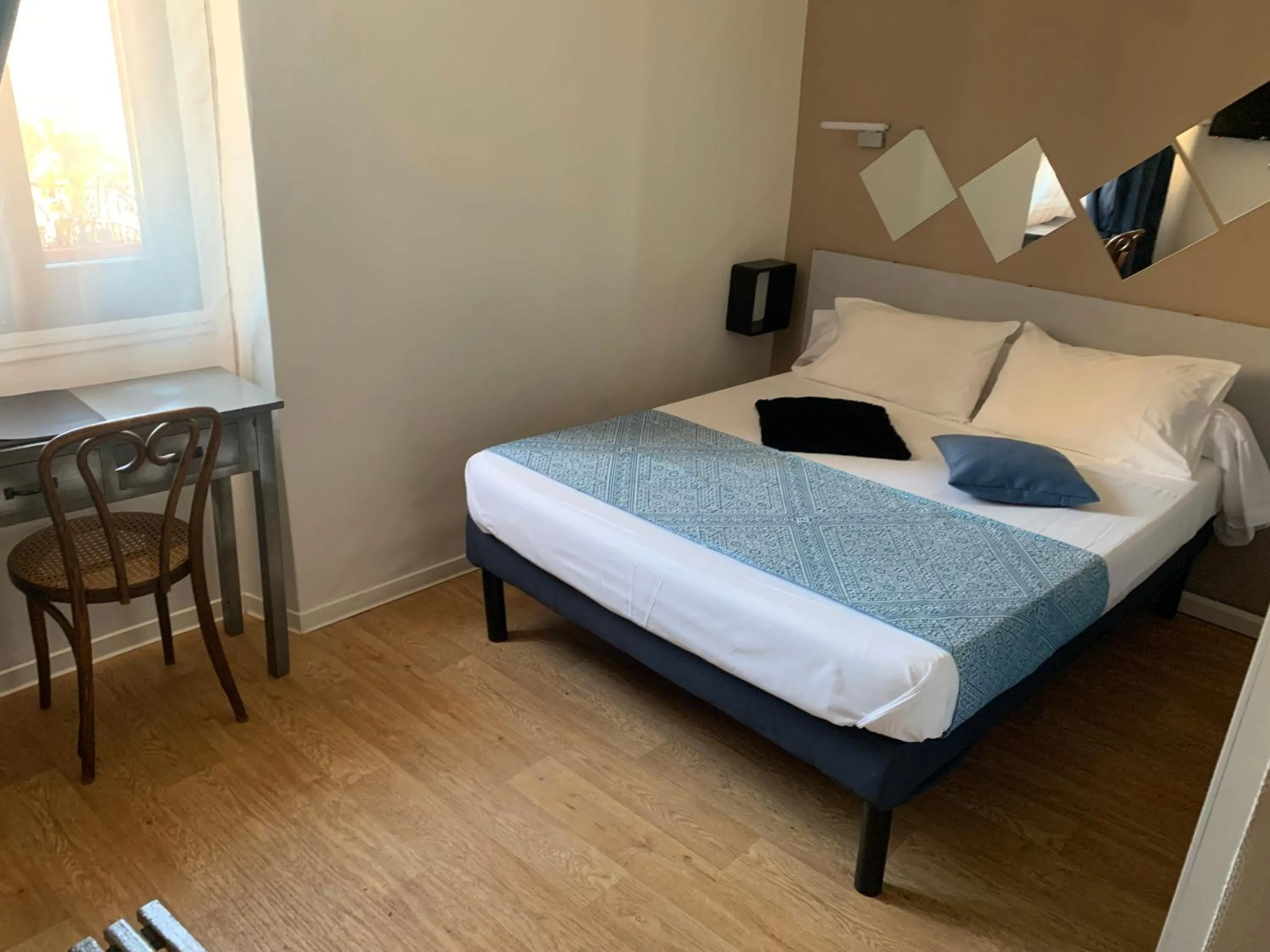 Bed in Le Cérétan Hôtel