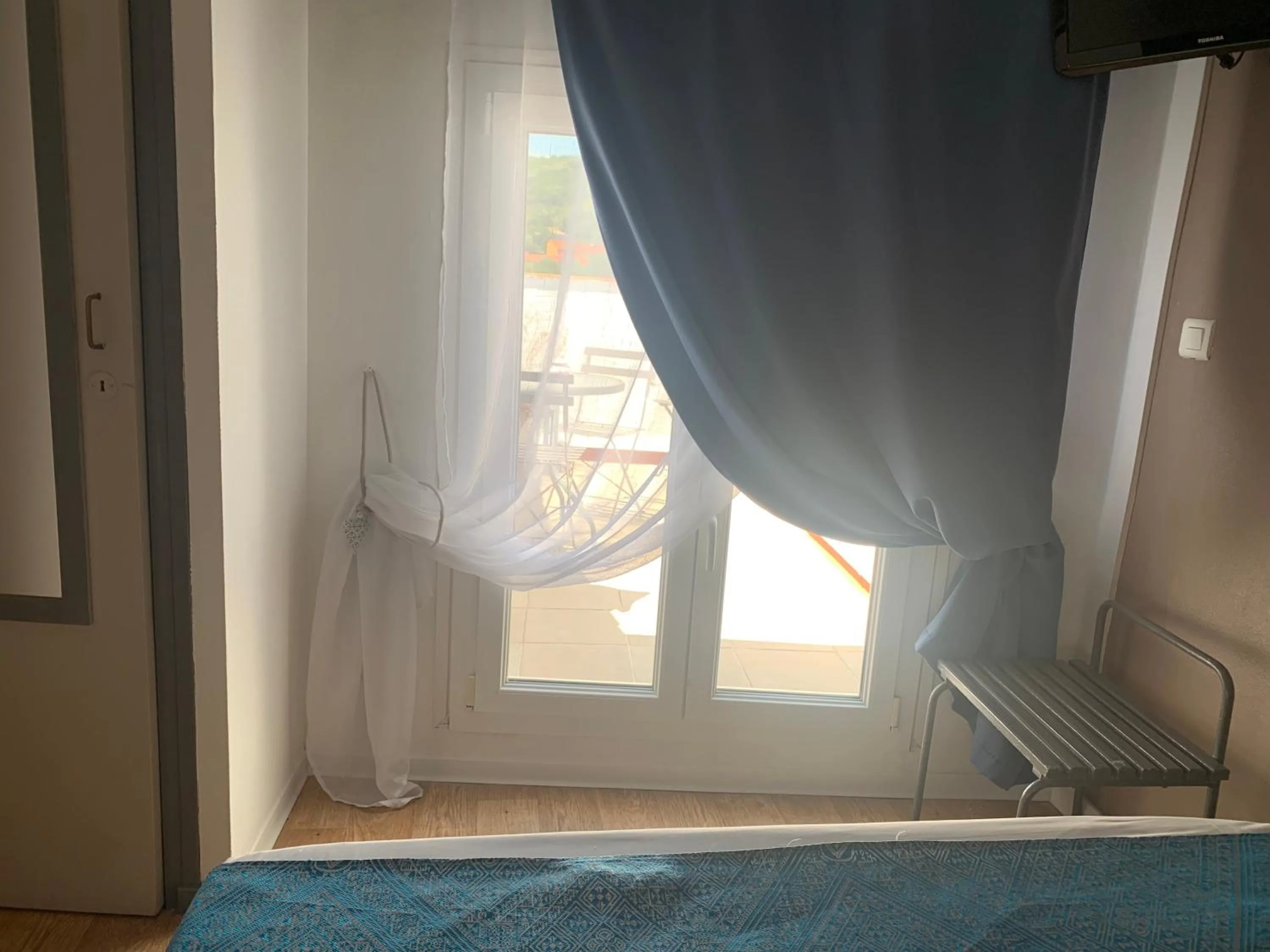 Bed in Le Cérétan Hôtel