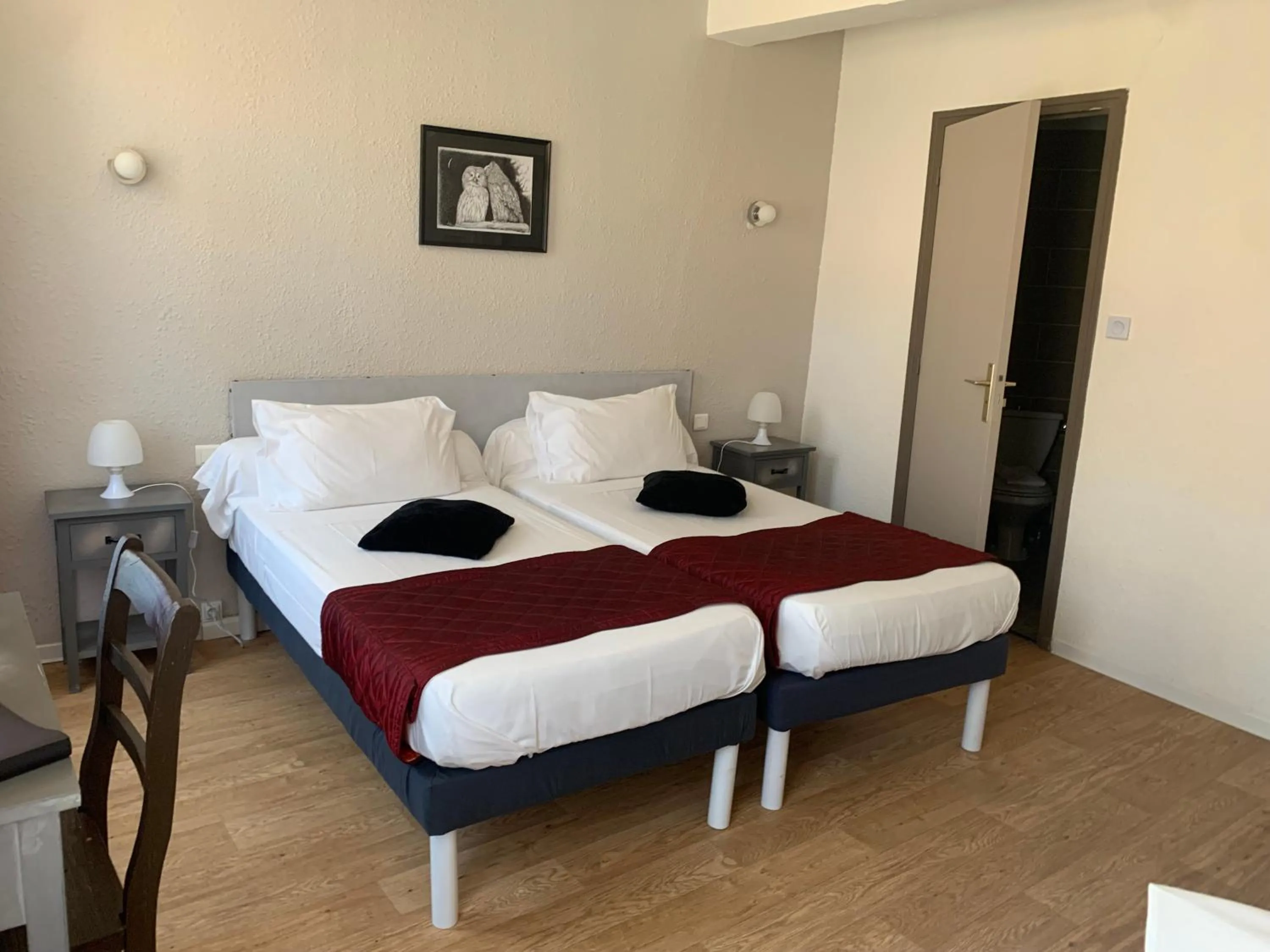 Bed in Le Cérétan Hôtel