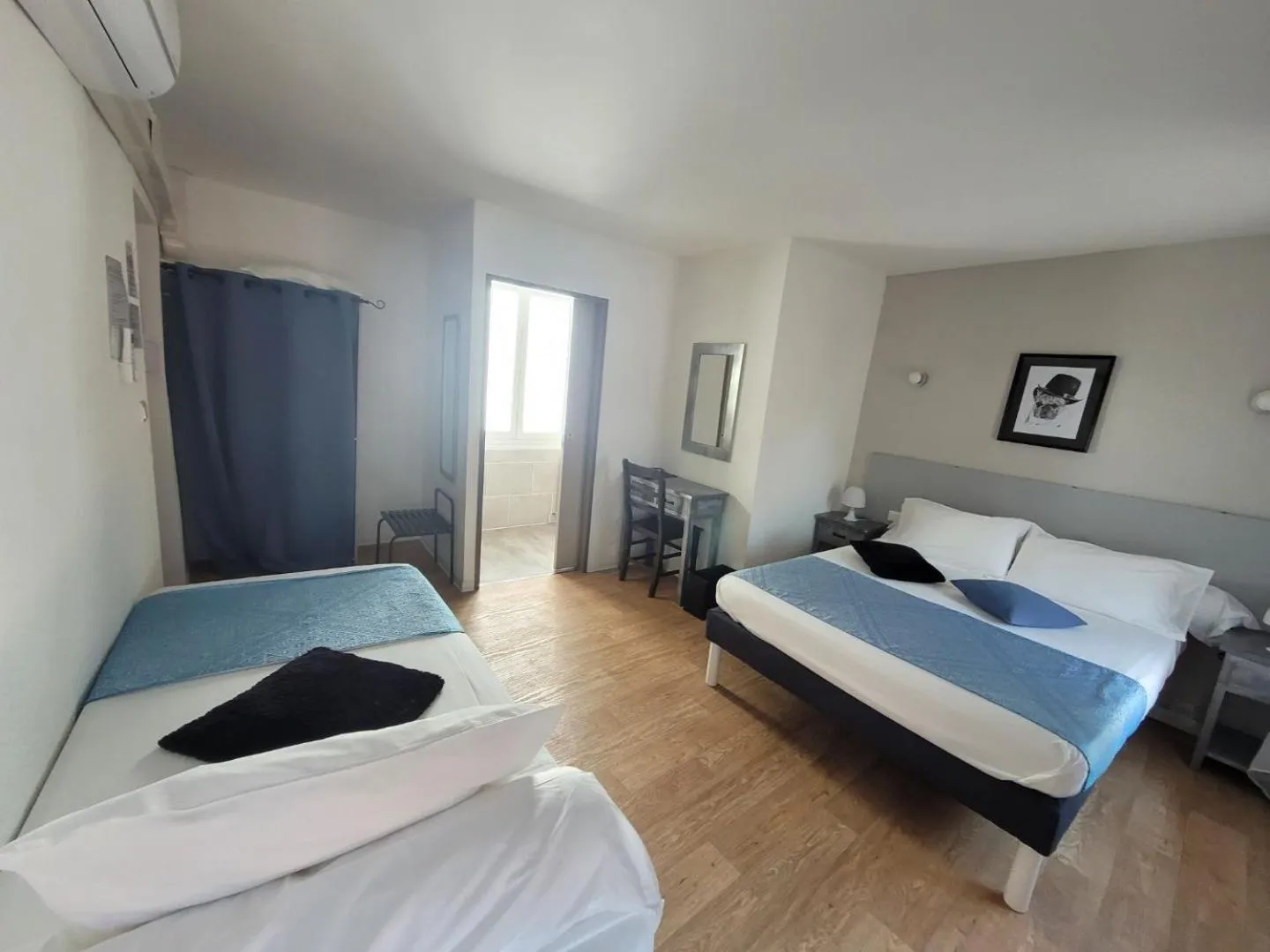 Bed in Le Cérétan Hôtel