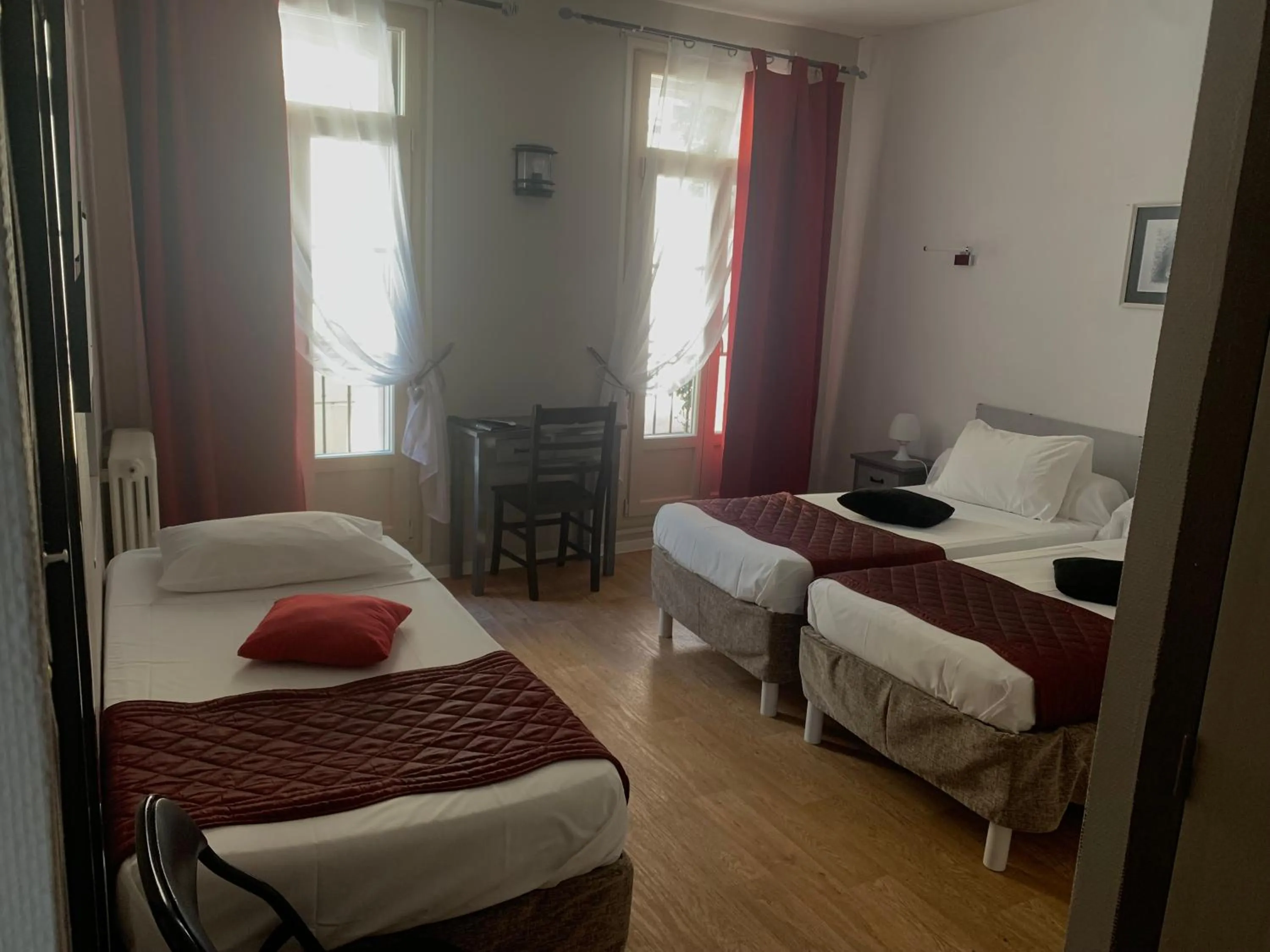 Bed in Le Cérétan Hôtel