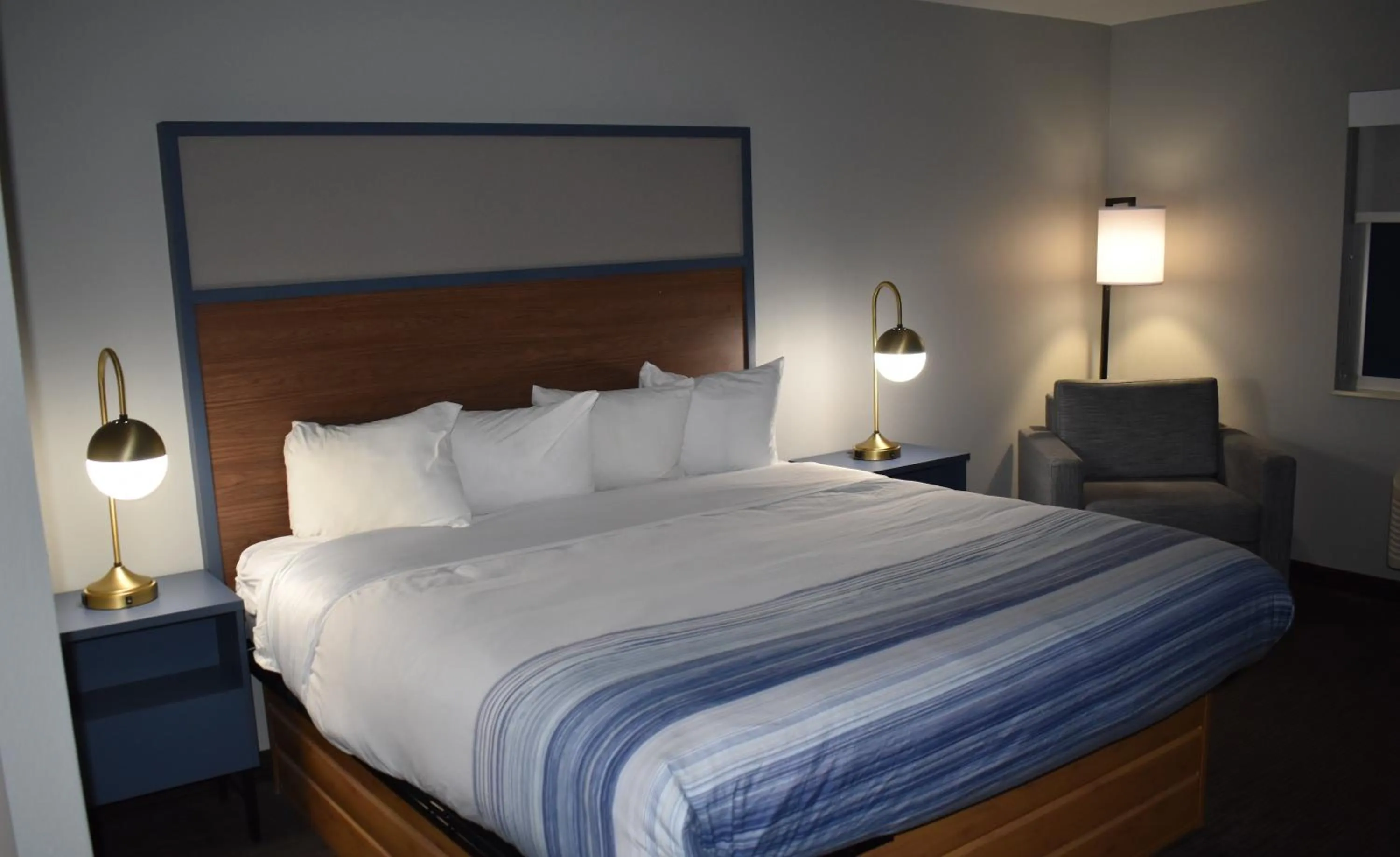 Bed in AmericInn by Wyndham Sioux City