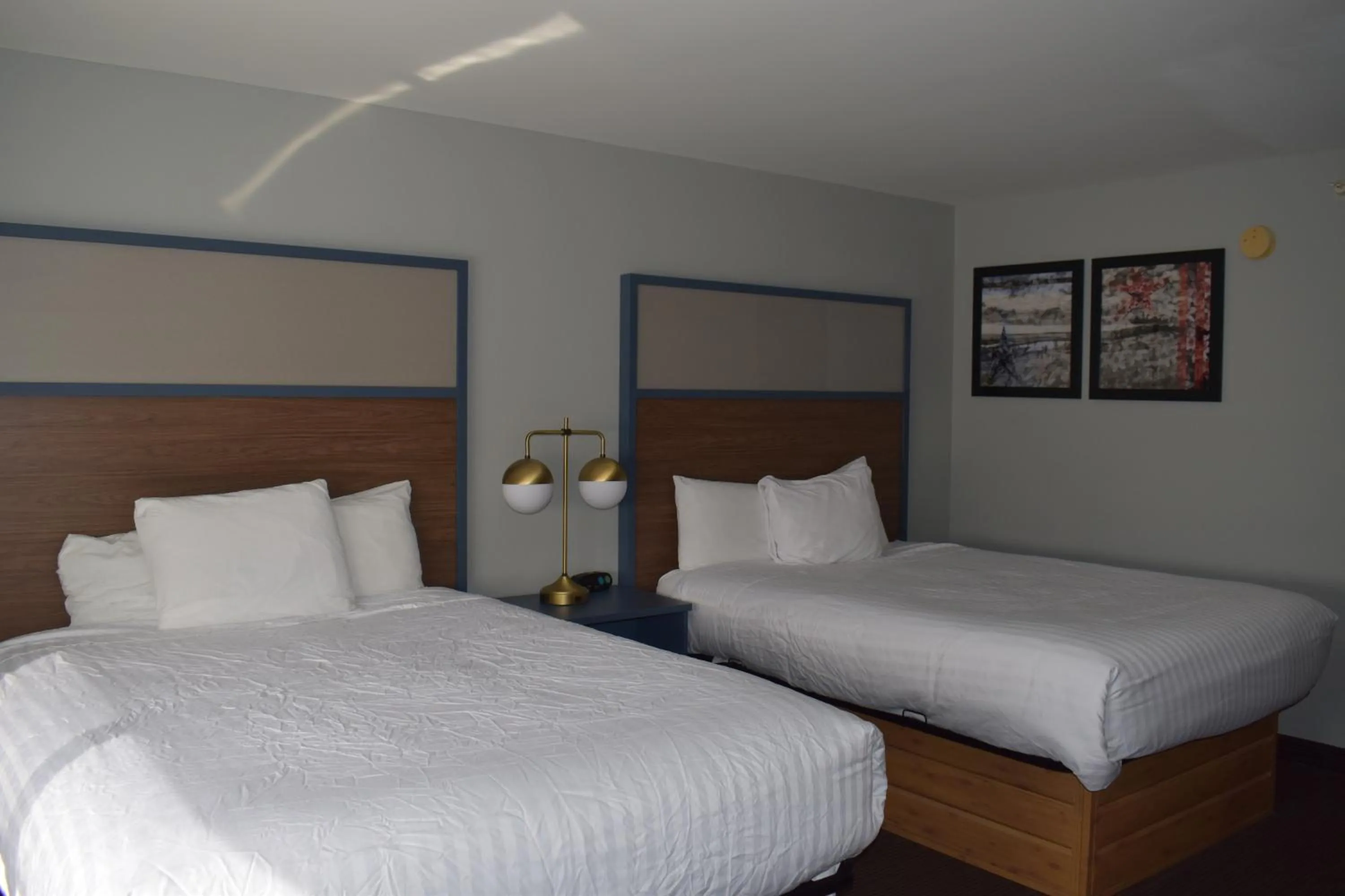 Bed in AmericInn by Wyndham Sioux City