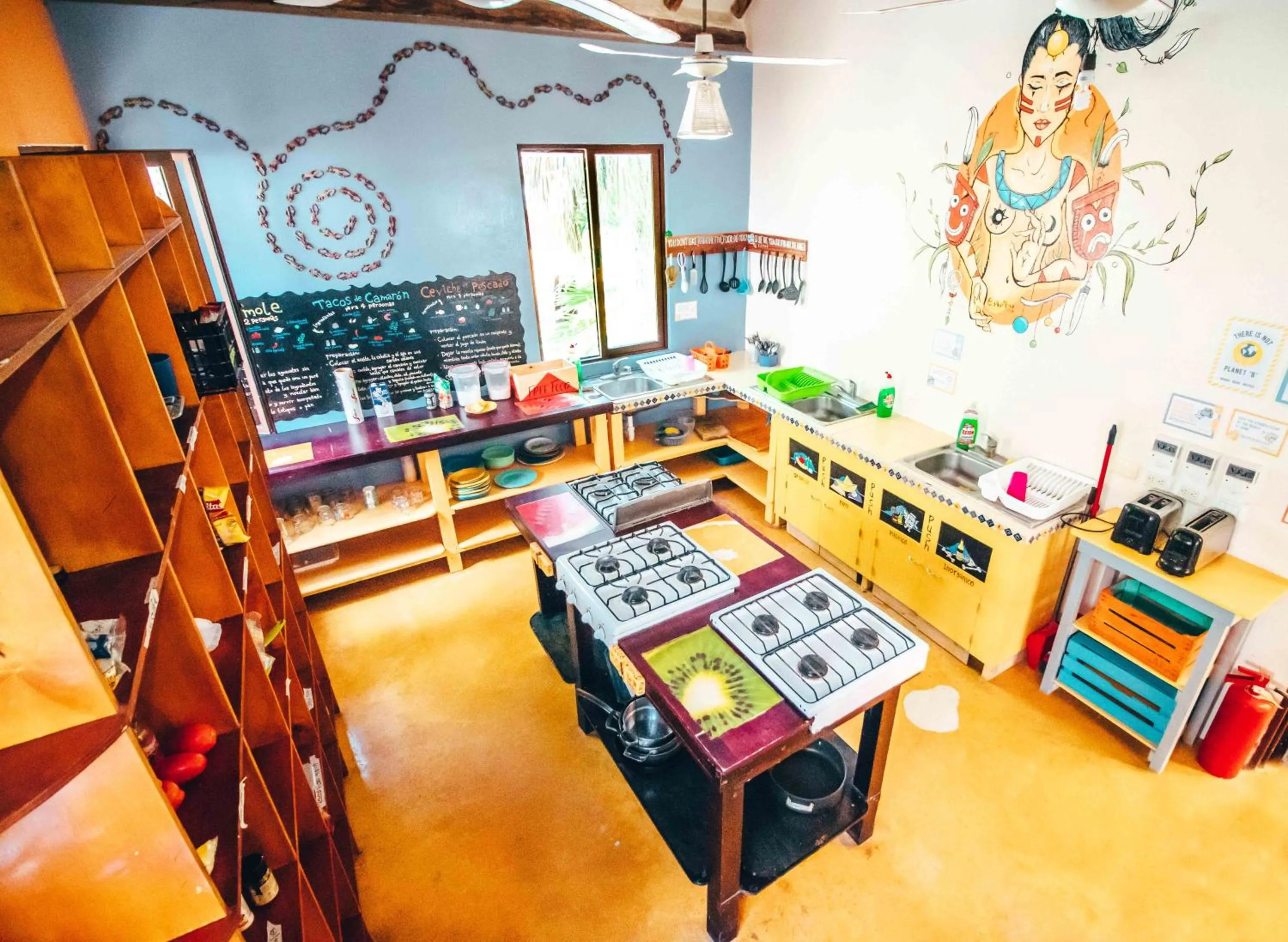 Communal kitchen in Tribu Hostel