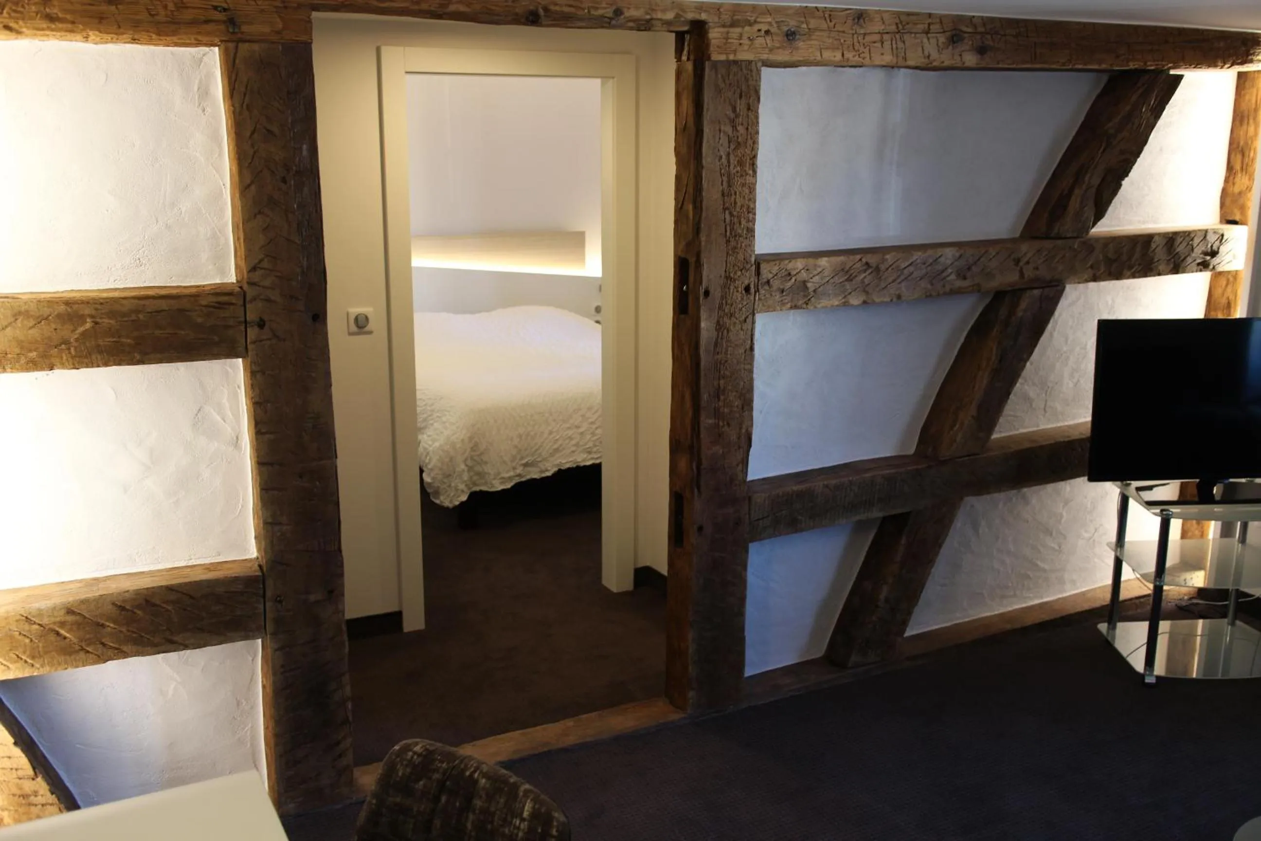 Seating area, Bed in Logis Hôtel Restaurant Au Lion Rouge