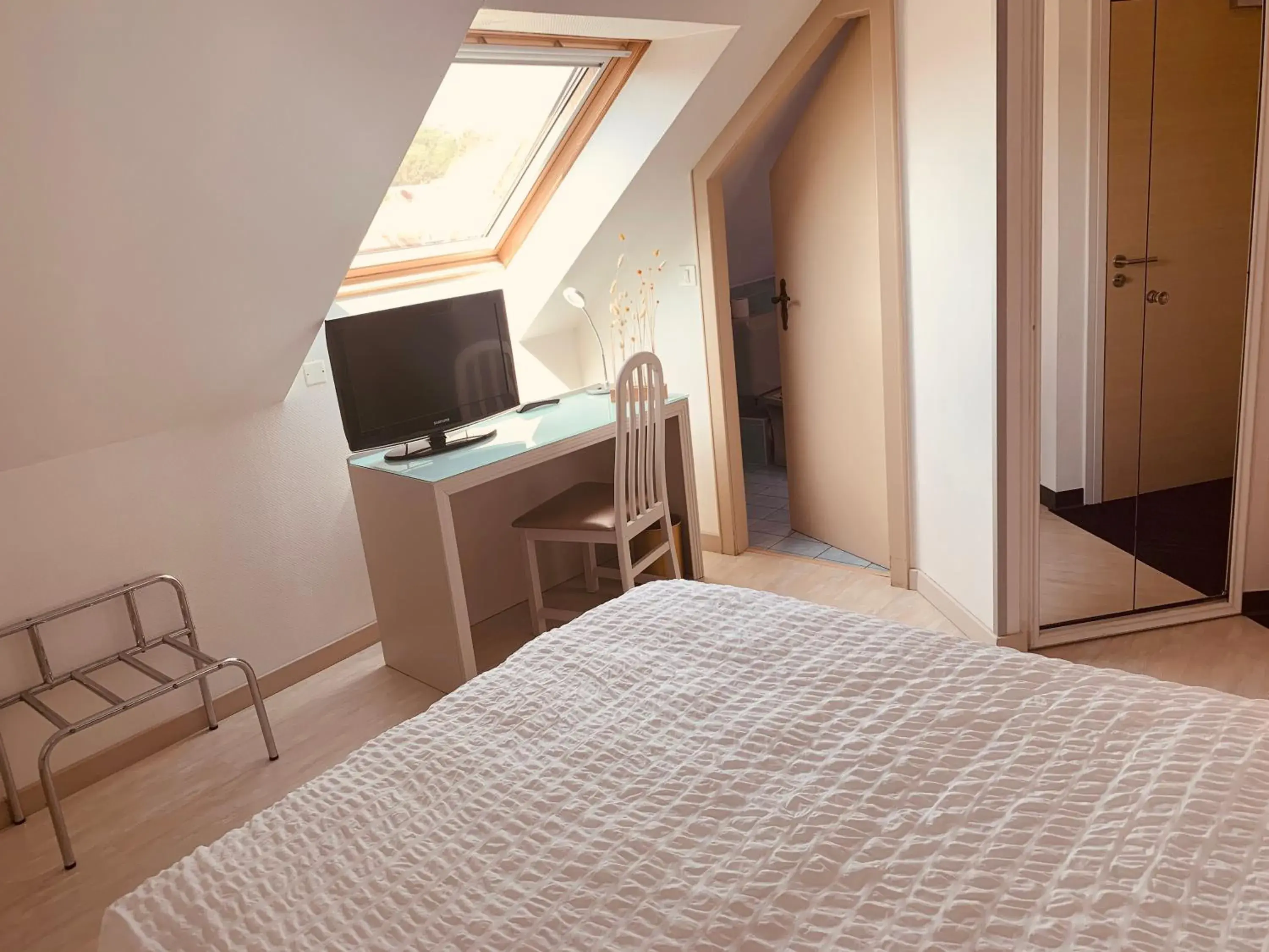 Photo of the whole room, Bed in Logis Hôtel Restaurant Au Lion Rouge Photo of the whole room, Bed in Logis Hôtel Restaurant Au Lion Rouge