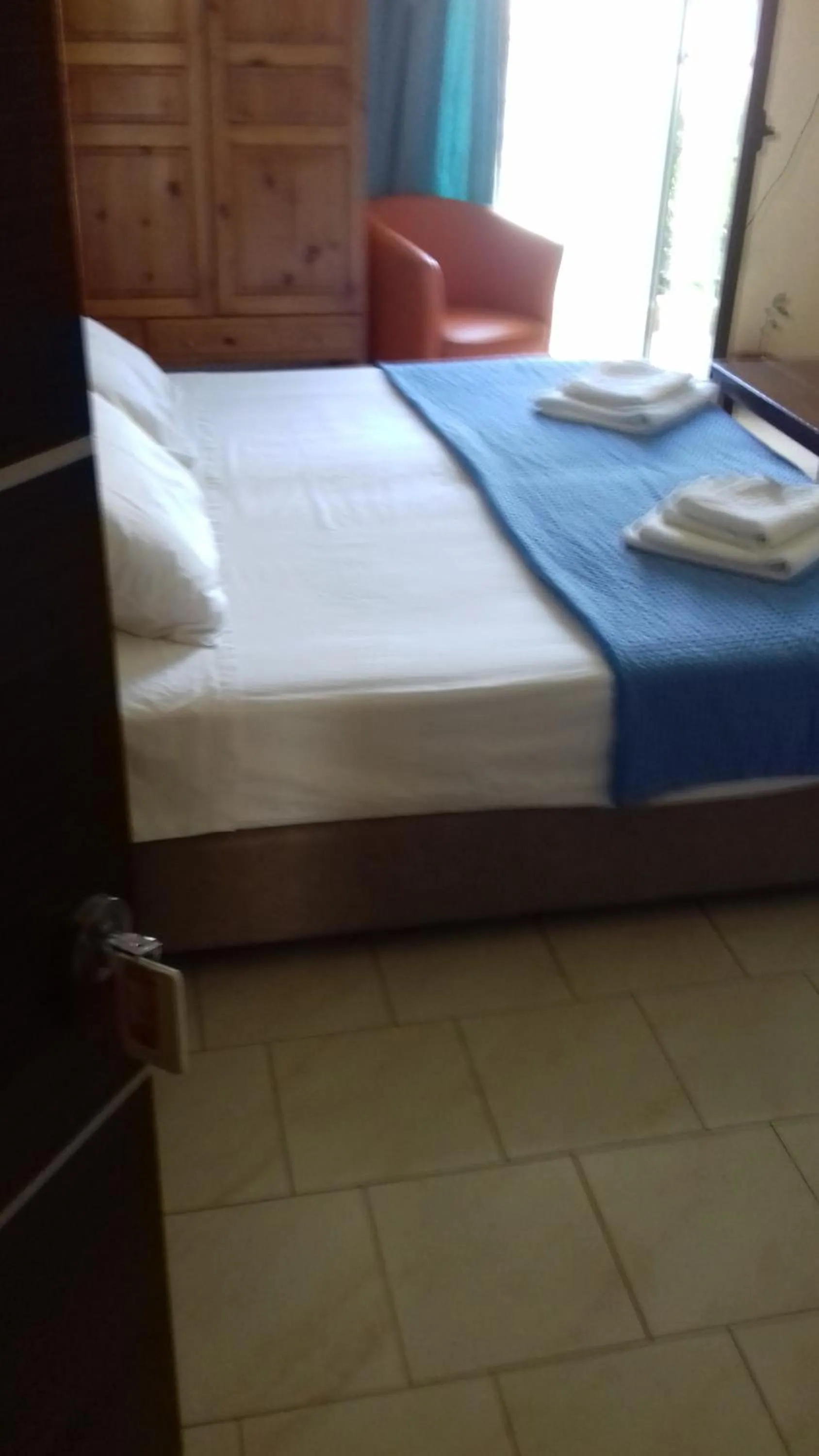 Bed in Parthenon Hotel