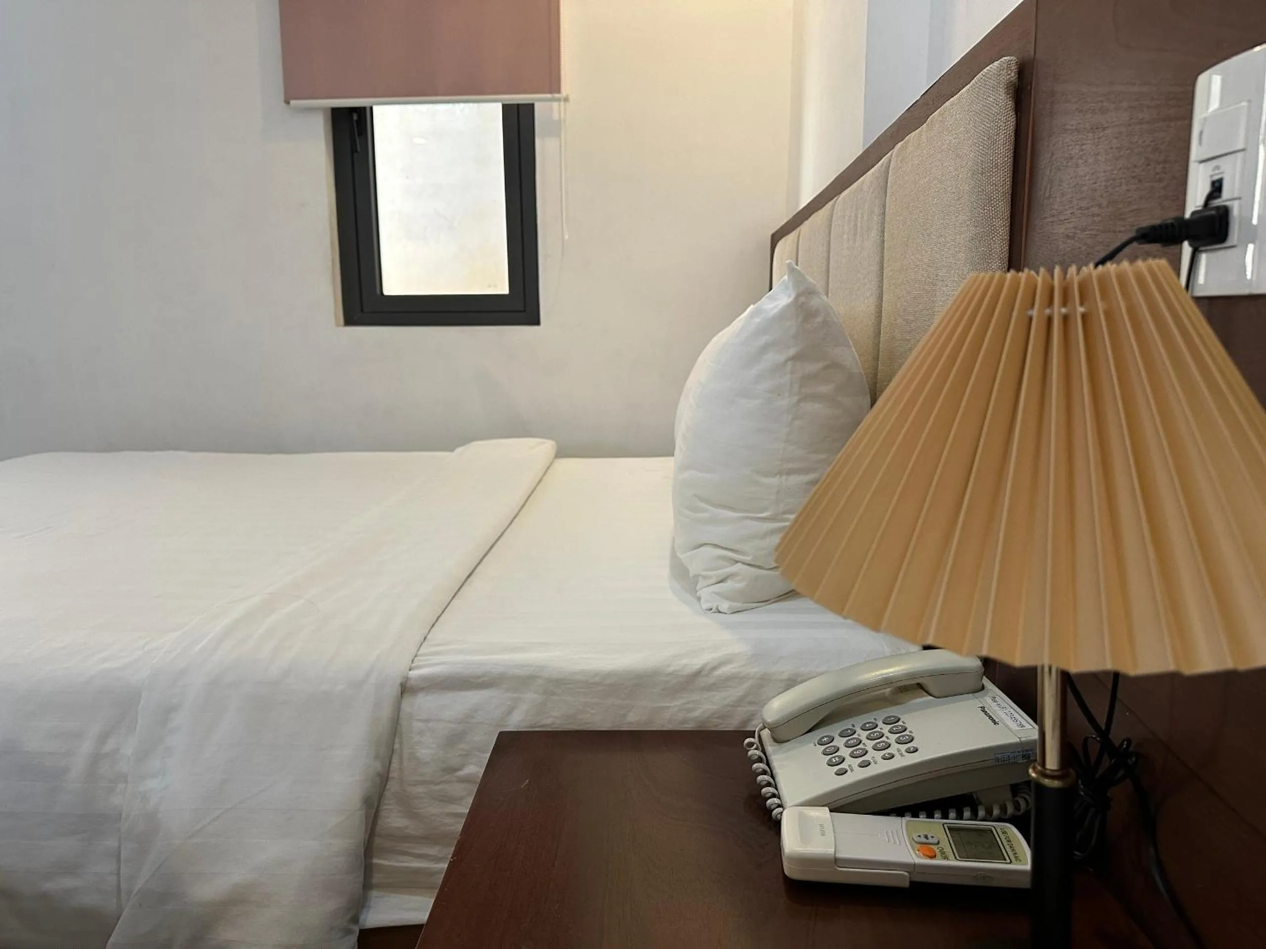 Bed in New Era Hotel & Apartments