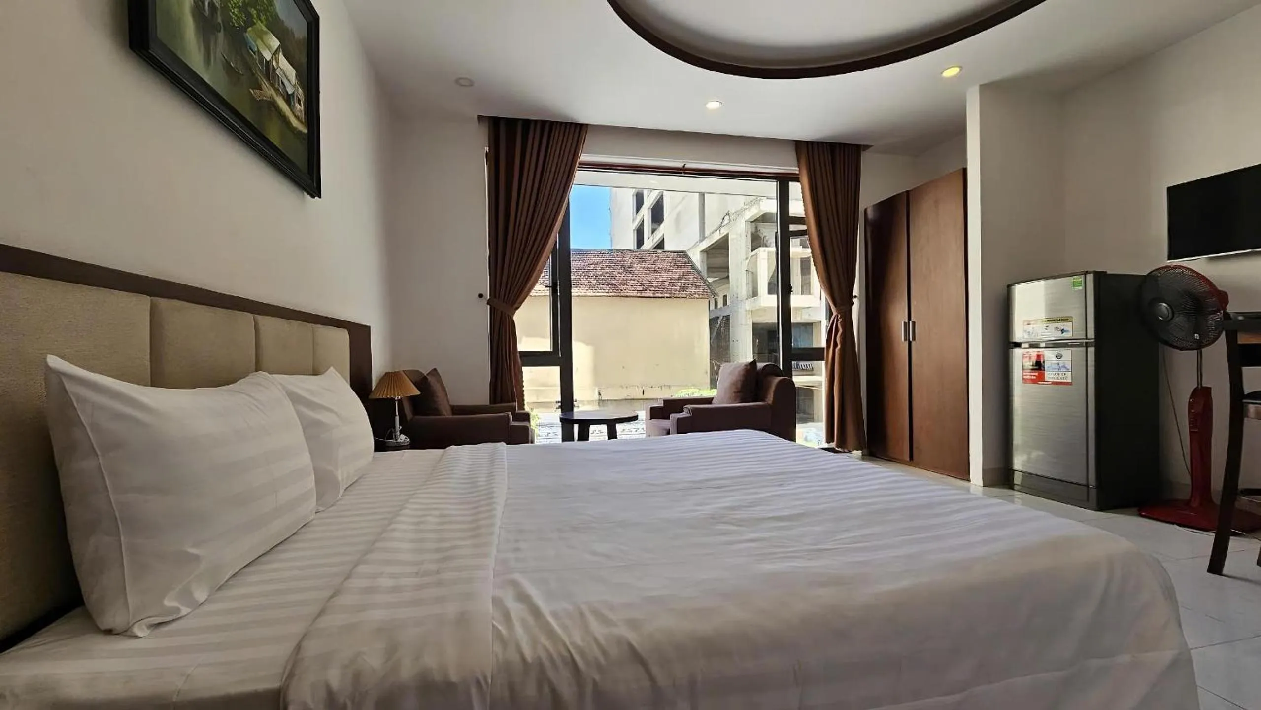 Bed in New Era Hotel & Apartments