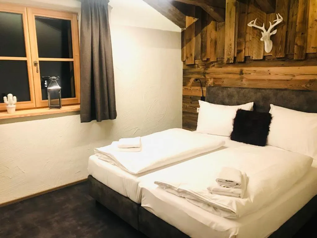 Bed in Sieglhub Chalets - Appartements - Hotel