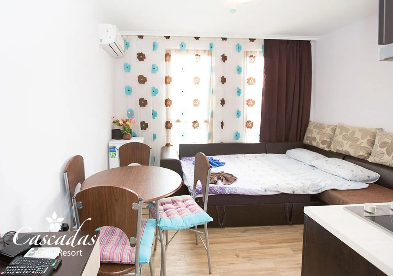 Living room, Bed in Cascadas Family Resort