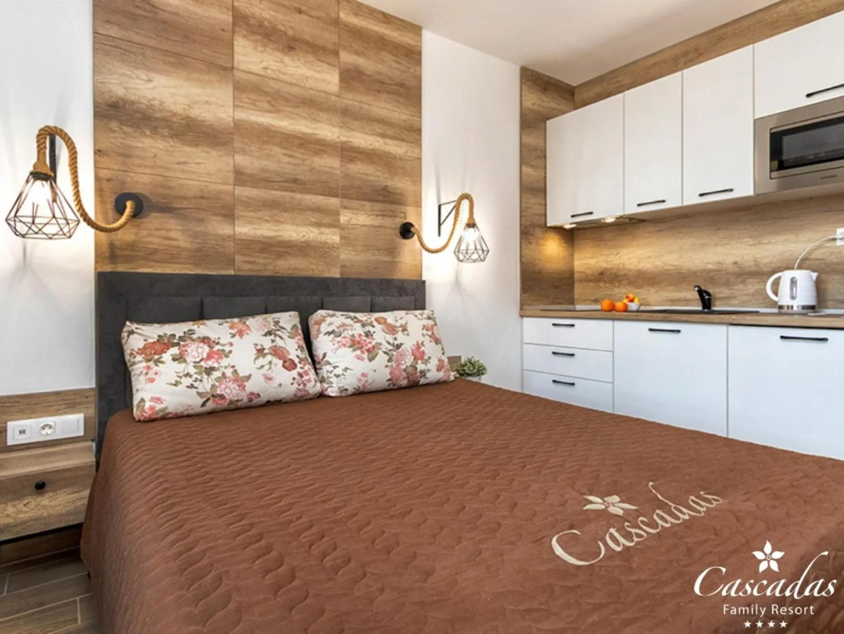 Kitchen or kitchenette, Bed in Cascadas Family Resort