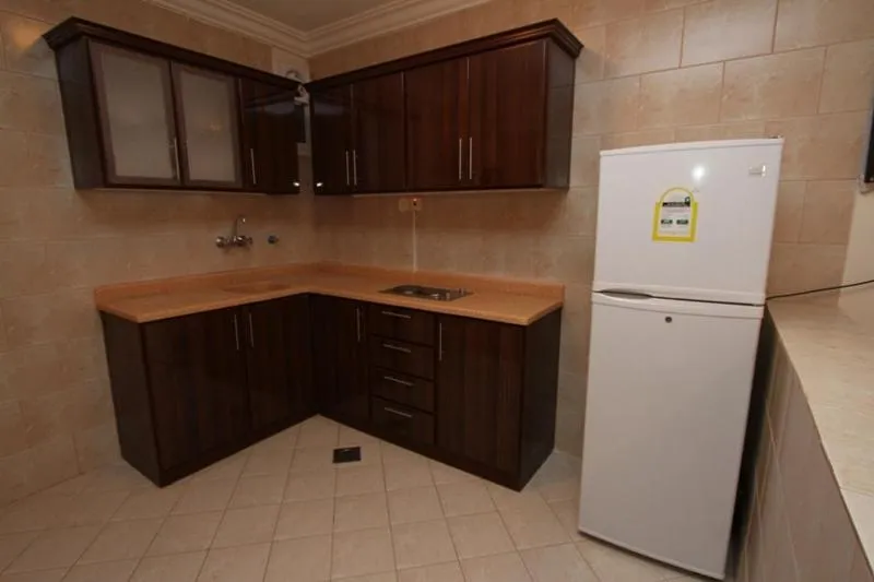 Kitchen or kitchenette in Raoum Inn Majmaa