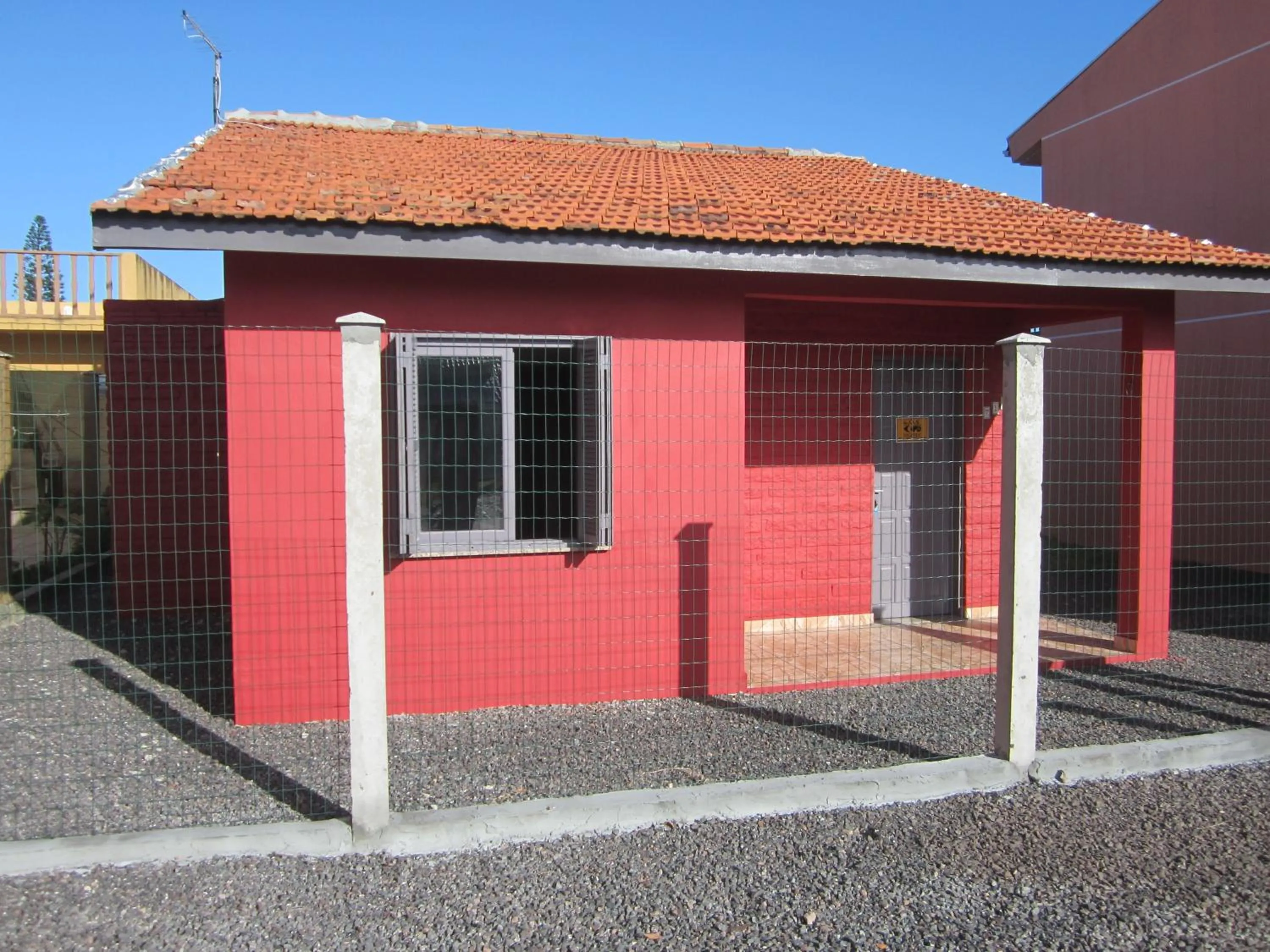 Facade/entrance in Oasis Sul Tramandaí Casa Vermelha