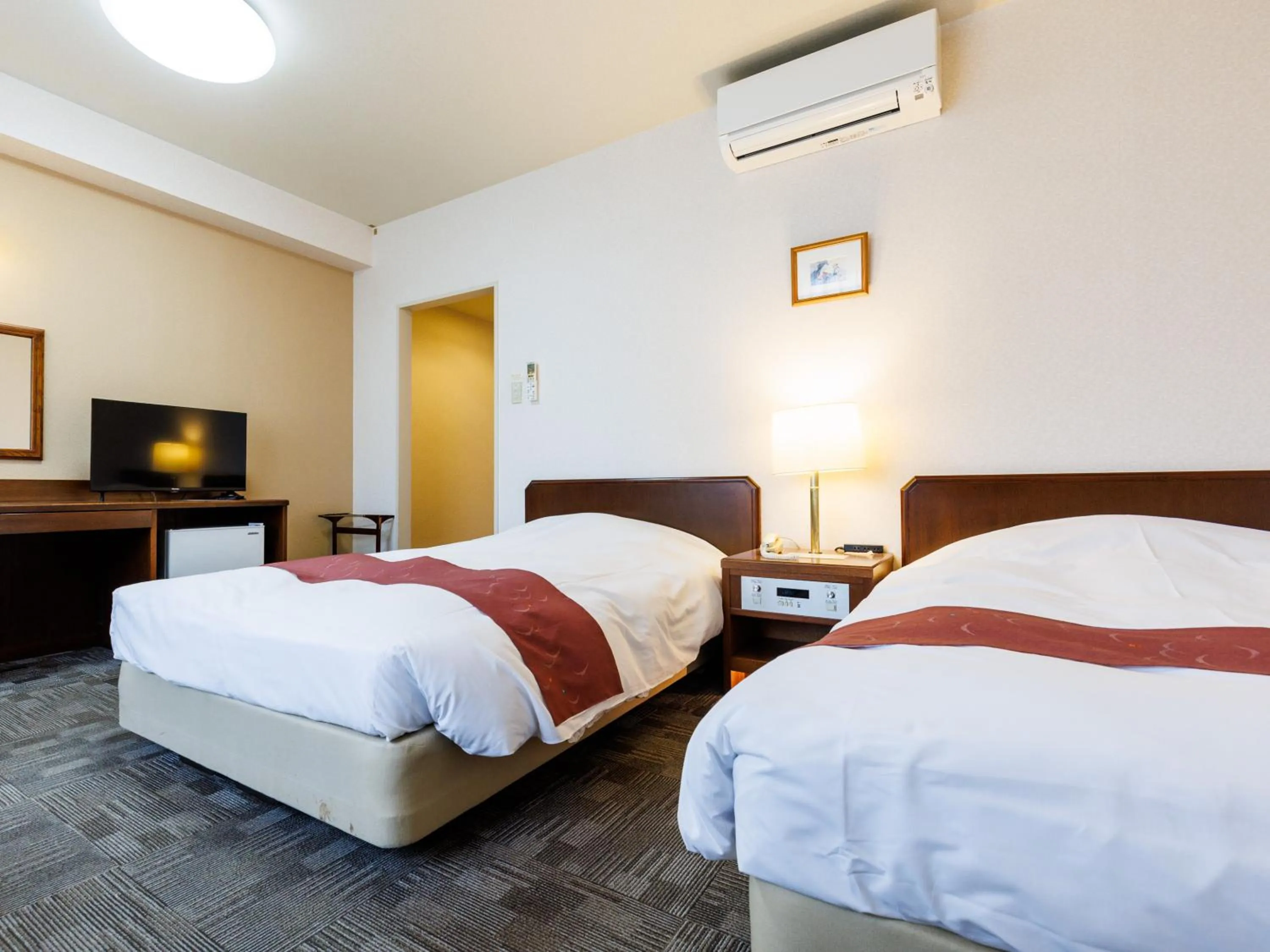 Bed in Tabist Hotel Nemuro Kaiyoutei