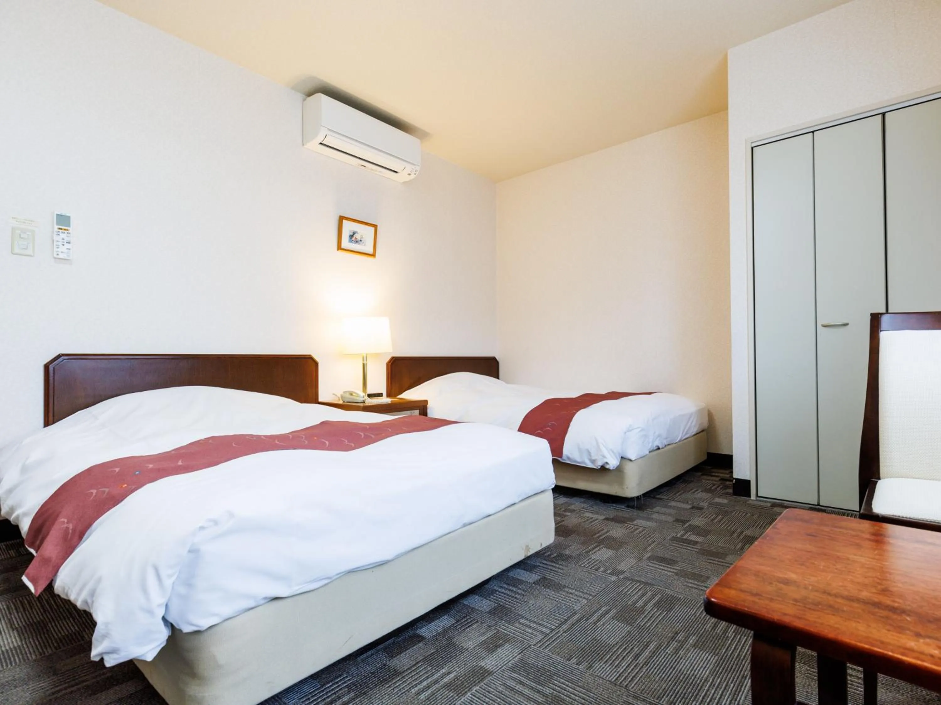 Bed in Tabist Hotel Nemuro Kaiyoutei