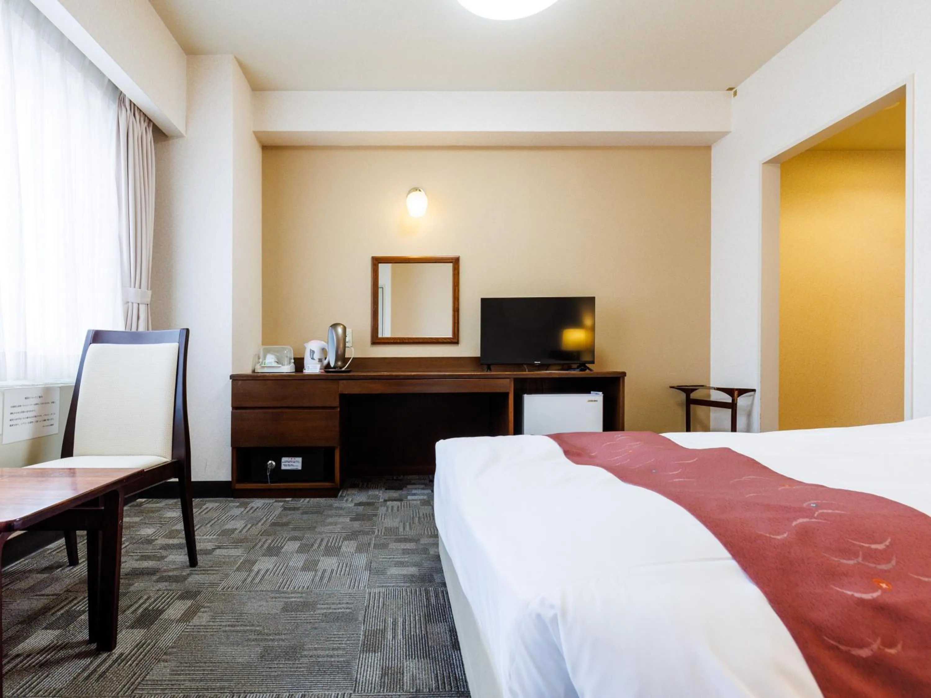 Bed in Tabist Hotel Nemuro Kaiyoutei