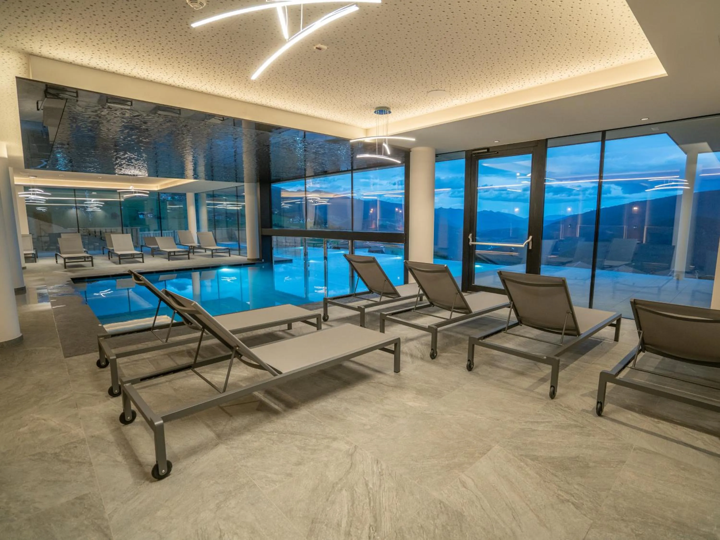 Swimming pool in Hotel Purvita by Oberlechner