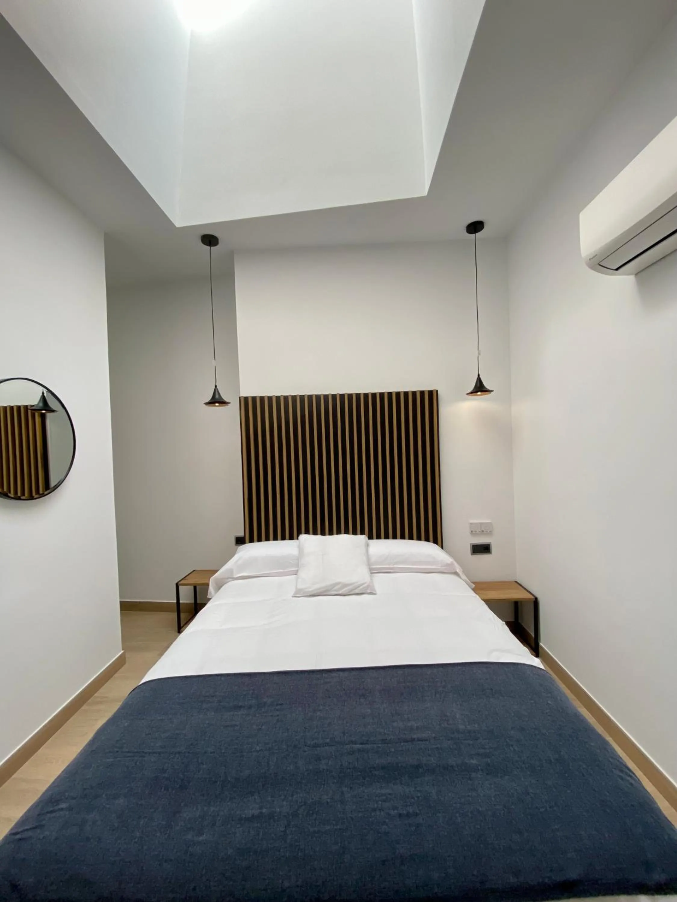 Bed in Evenia Alcalá Boutique Hotel